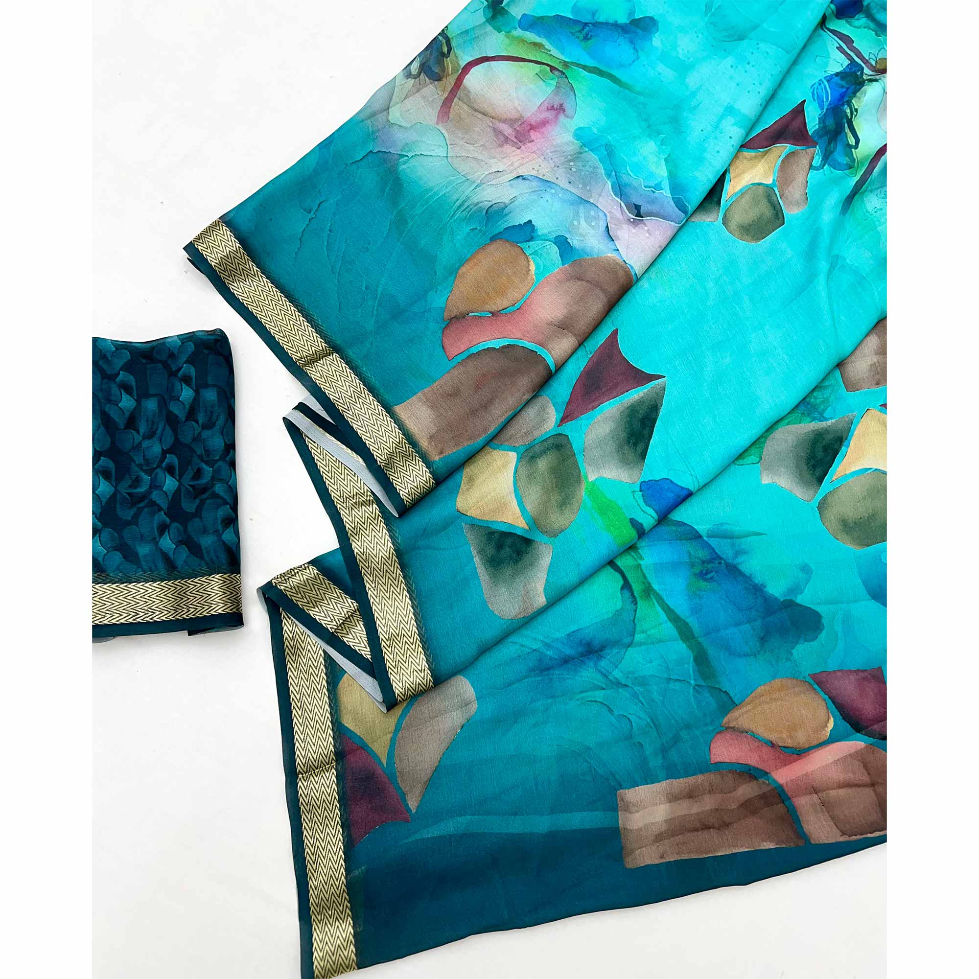 Graceful Turquoise Georgette Saree Accented With Digital Prints & Viscose Border Finish
