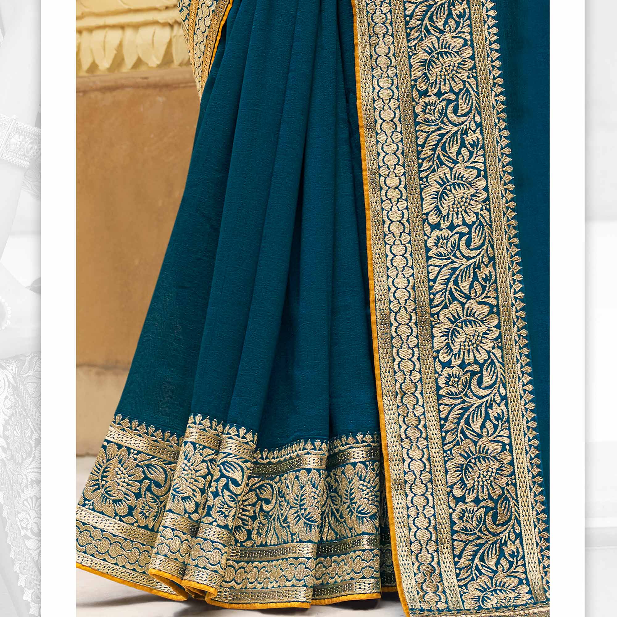 Teal Solid With Embroidered Border Vichitra Silk Saree