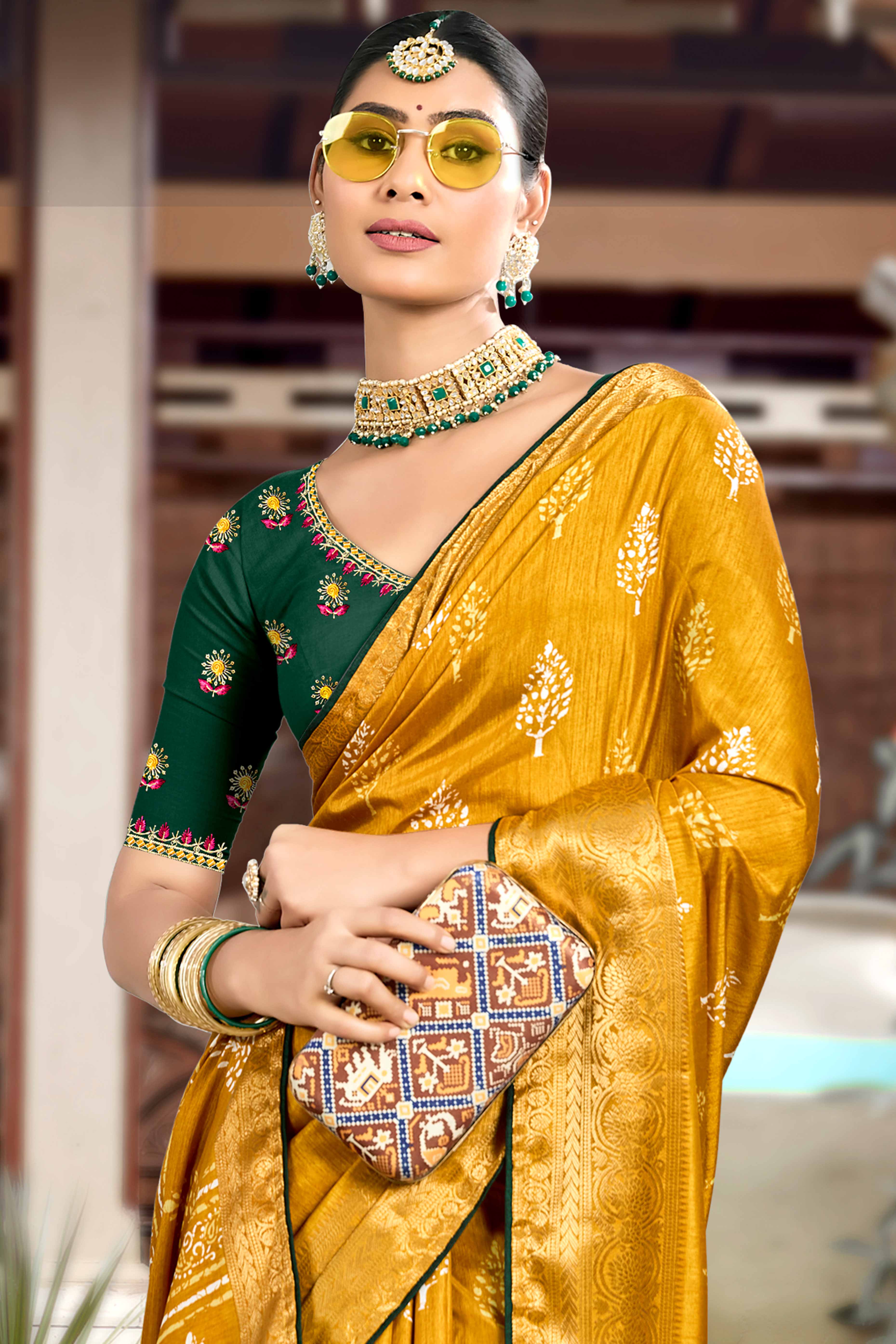 Mustard Dola Silk Saree Featuring Artistic Print Work & Graceful Tassel Edging