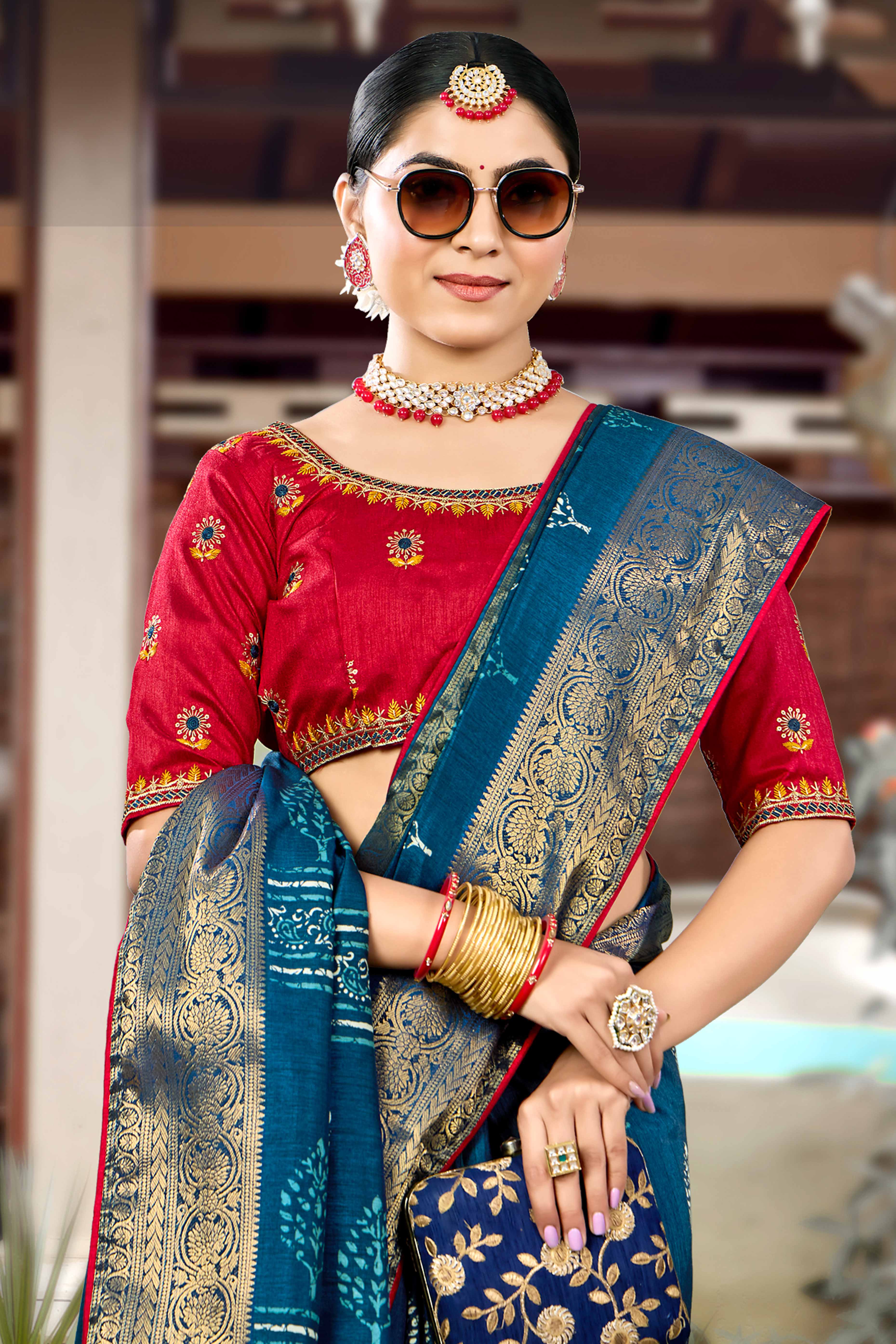 Blue Dola Silk Saree Featuring Artistic Print Work & Graceful Tassel Edging