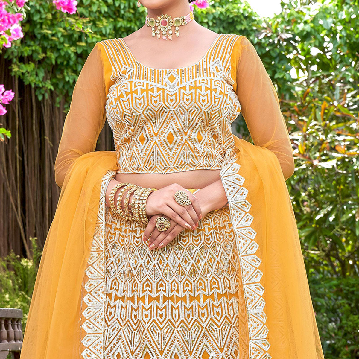 Yellow Sequins Embroidered Net Semi Stitched Lehenga Choli
