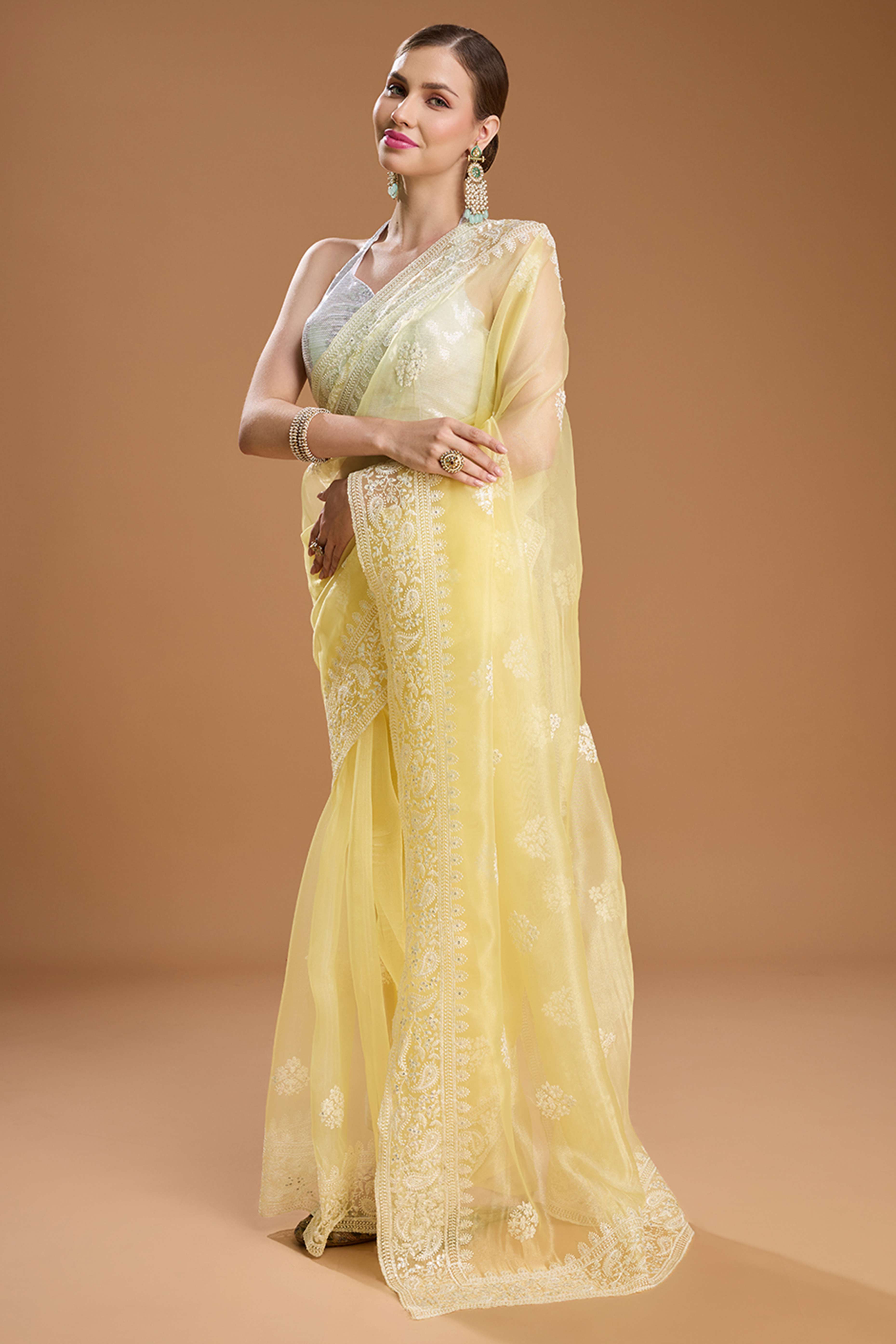 Light Yellow Net Saree Enhanced with Elegant Sequins Embellishments