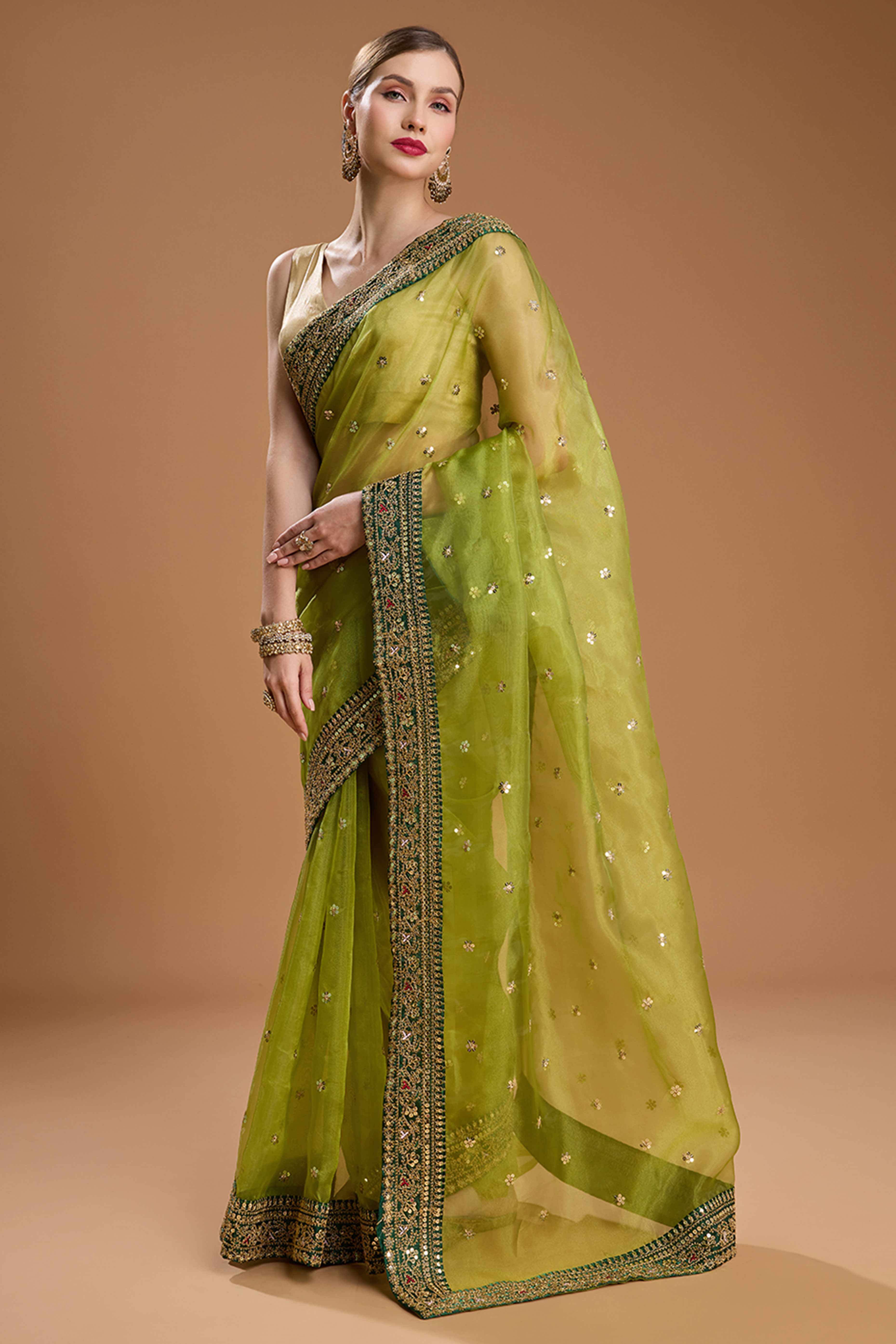 Green Organza Saree Enhanced with Elegant Sequins Embellishments
