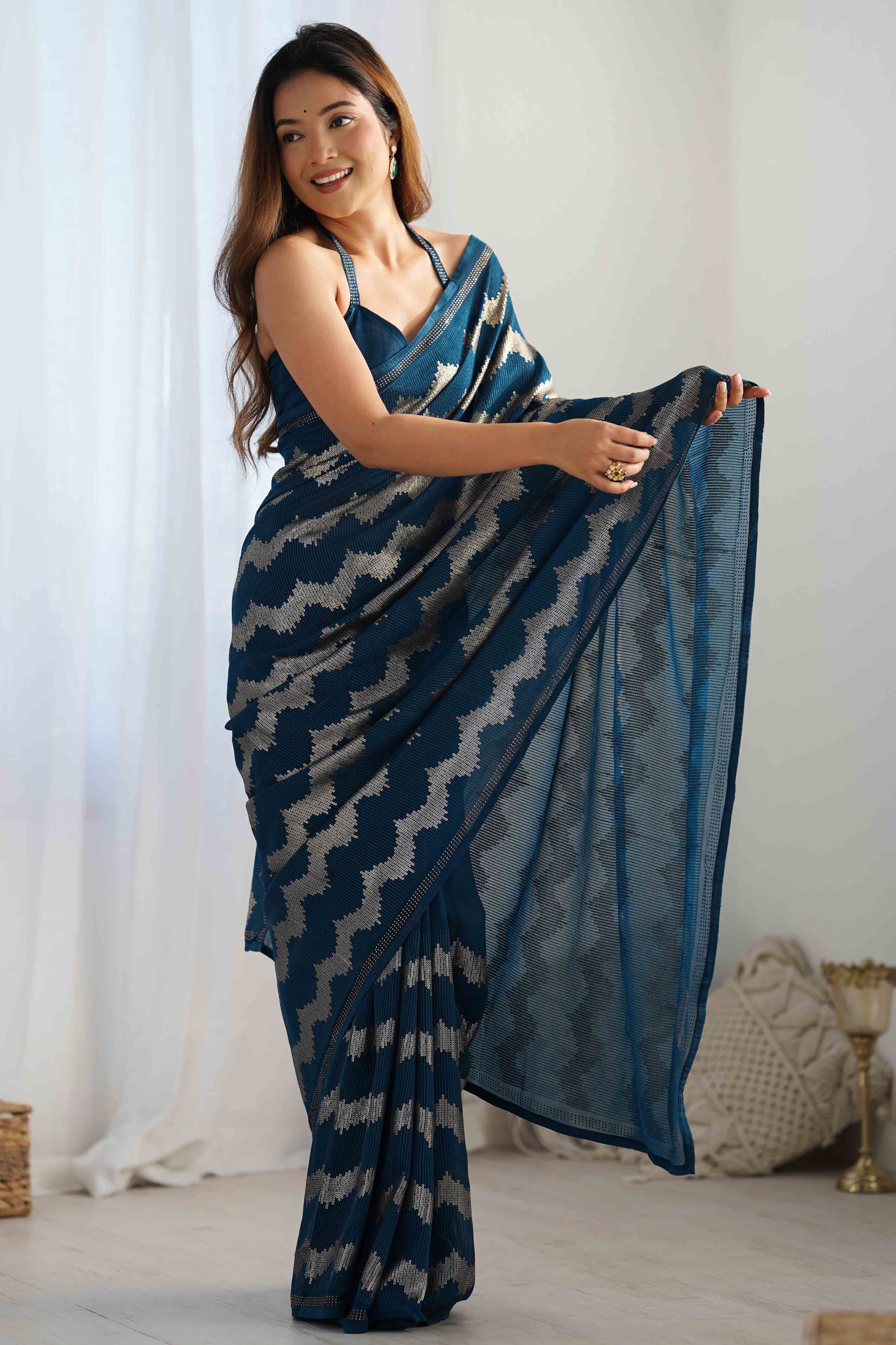 Teal Sequins Embroidered Georgette Saree