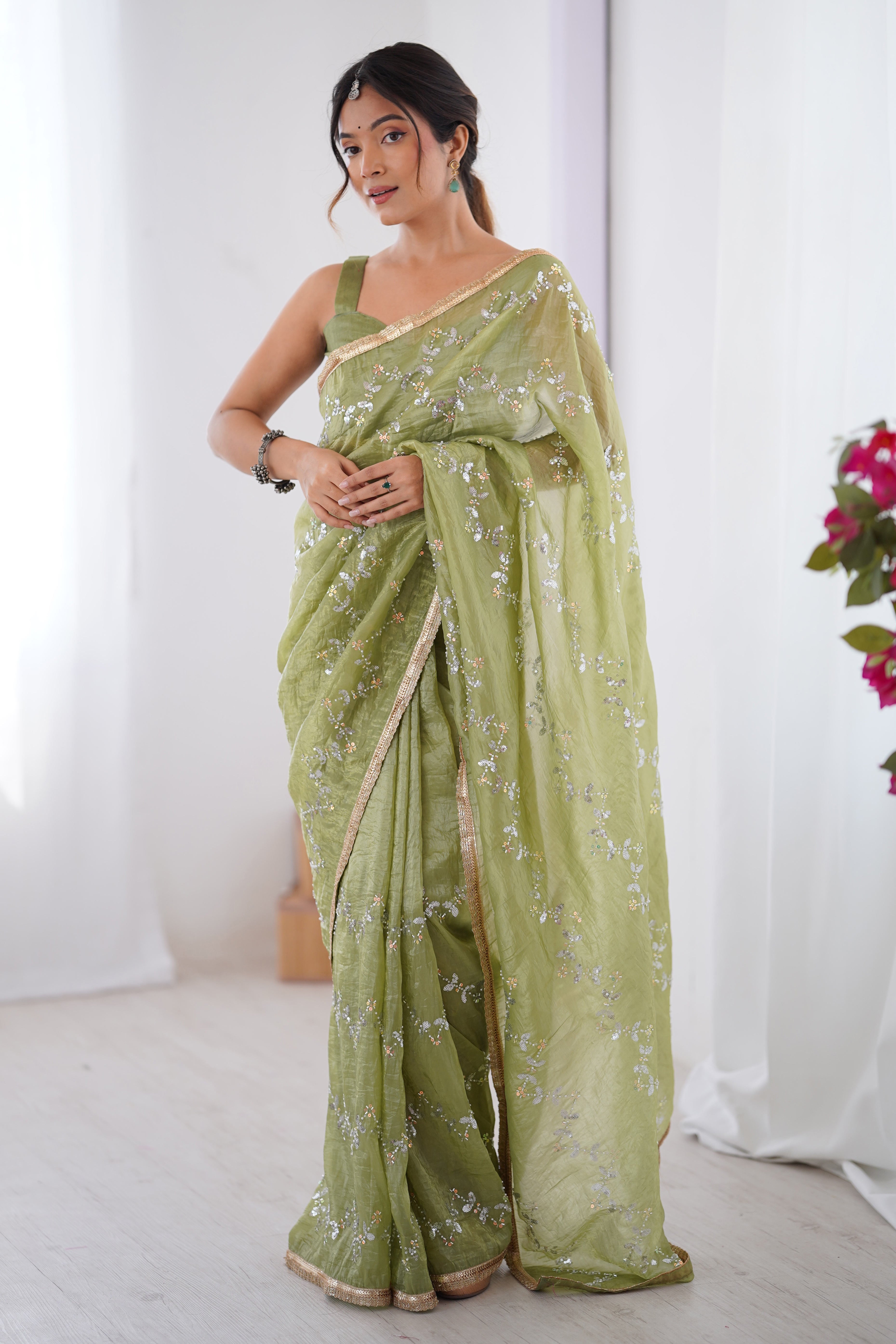 Dazzling Pista Green Organza Saree Accented with Sequin, Bead & Stone Work and Delicate Lace Detailing