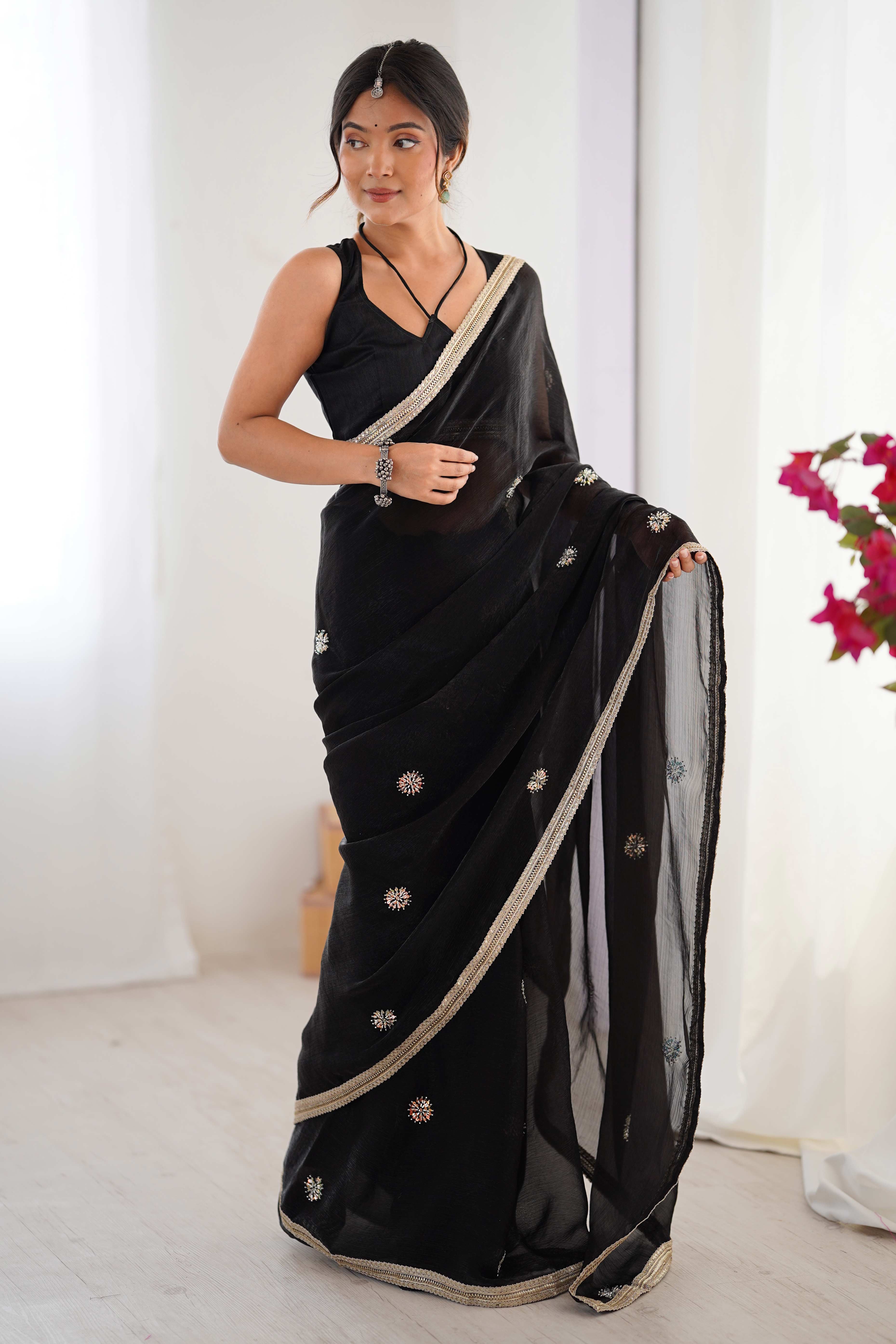 Elegant Black Organza Saree with Delicate Floral Embellishments and Lace Border