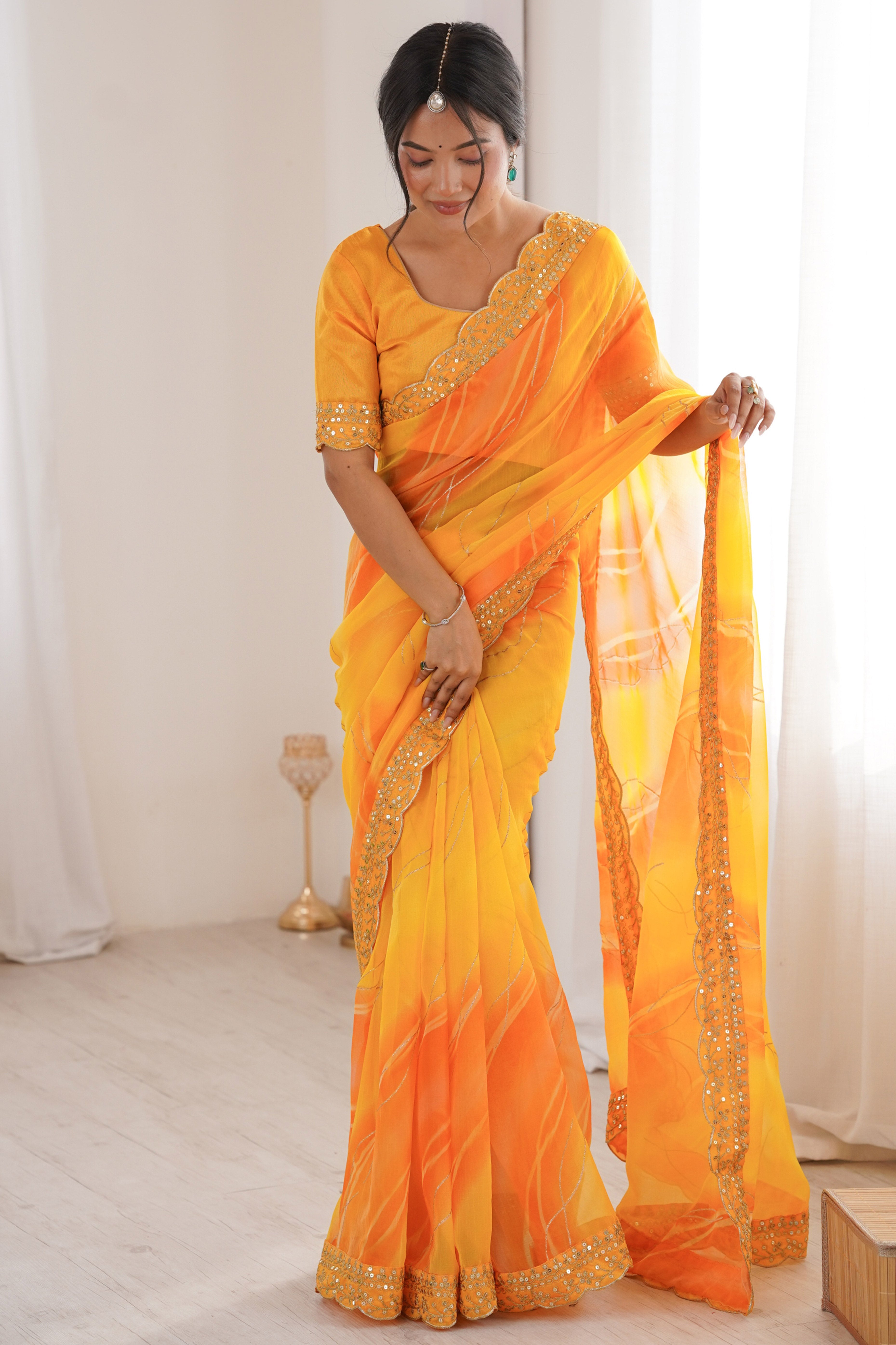 Graceful Yellow Foil Print Georgette Saree Featuring A Luxurious Cording Sequins Embroidered Border