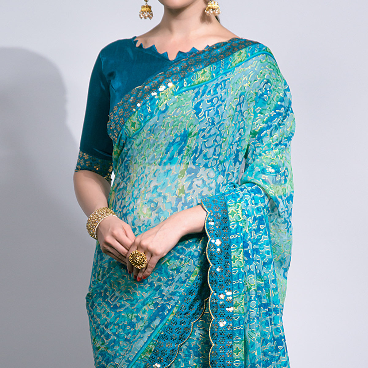 Blue Foil Printed Chiffon Saree With Embroidered Border