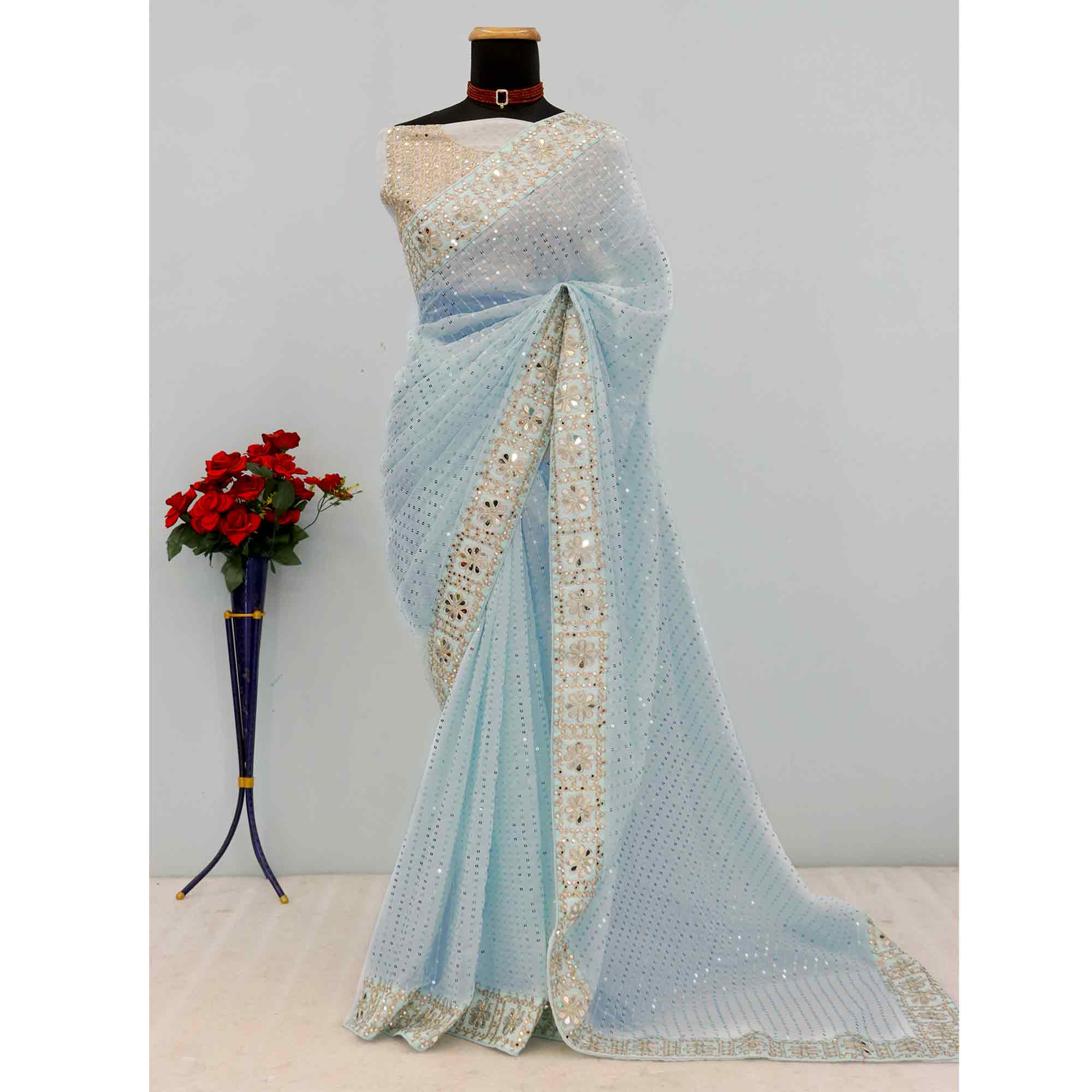 Sky Blue Faux Georgette Saree Adorned with Sequins Work and Elegant Embellishments