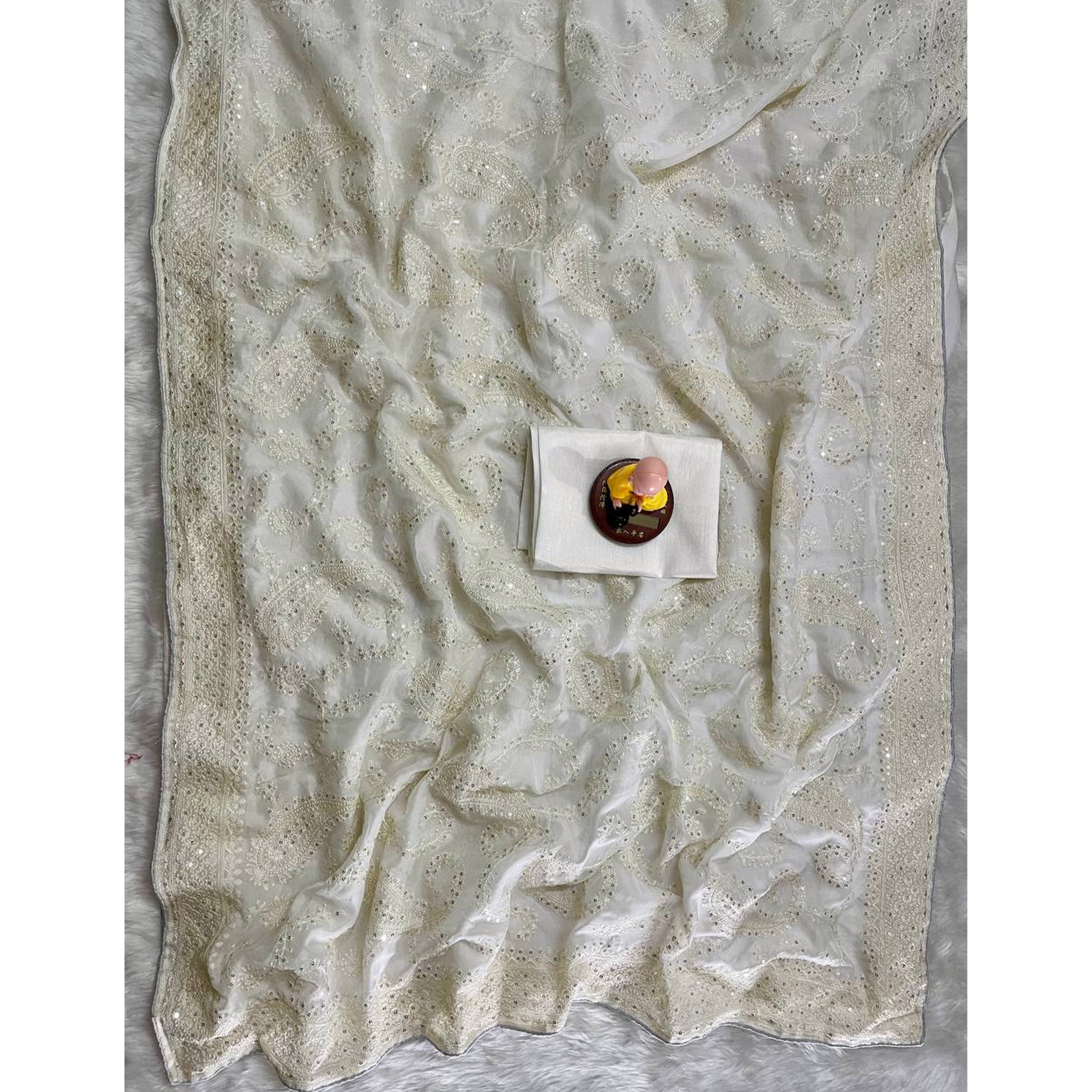 Lustrous White Organza Silk Saree Beautified With Paisley Embroidery & Glittering Sequins Work