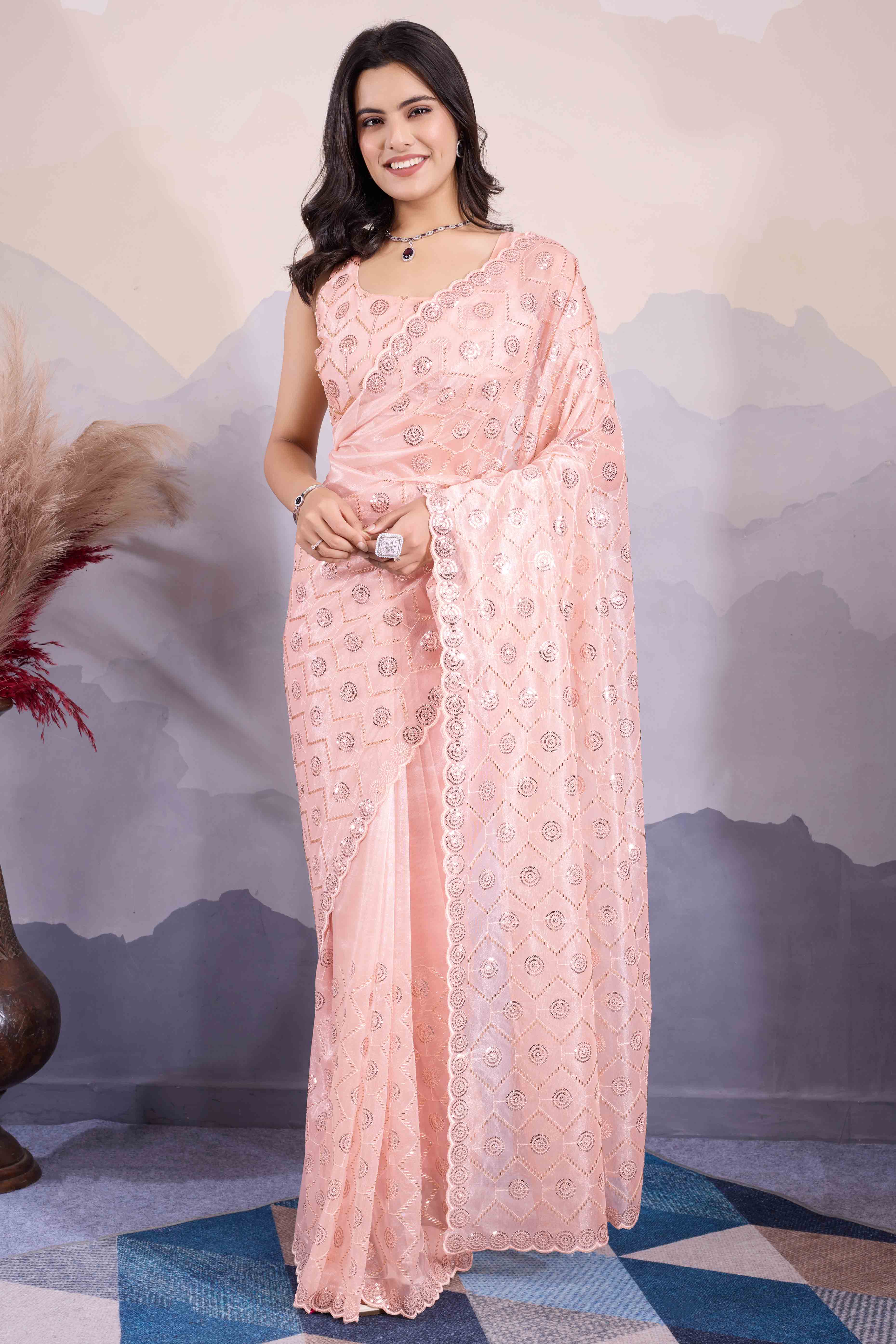 Peach Sequins Embroidered Twill Net Saree