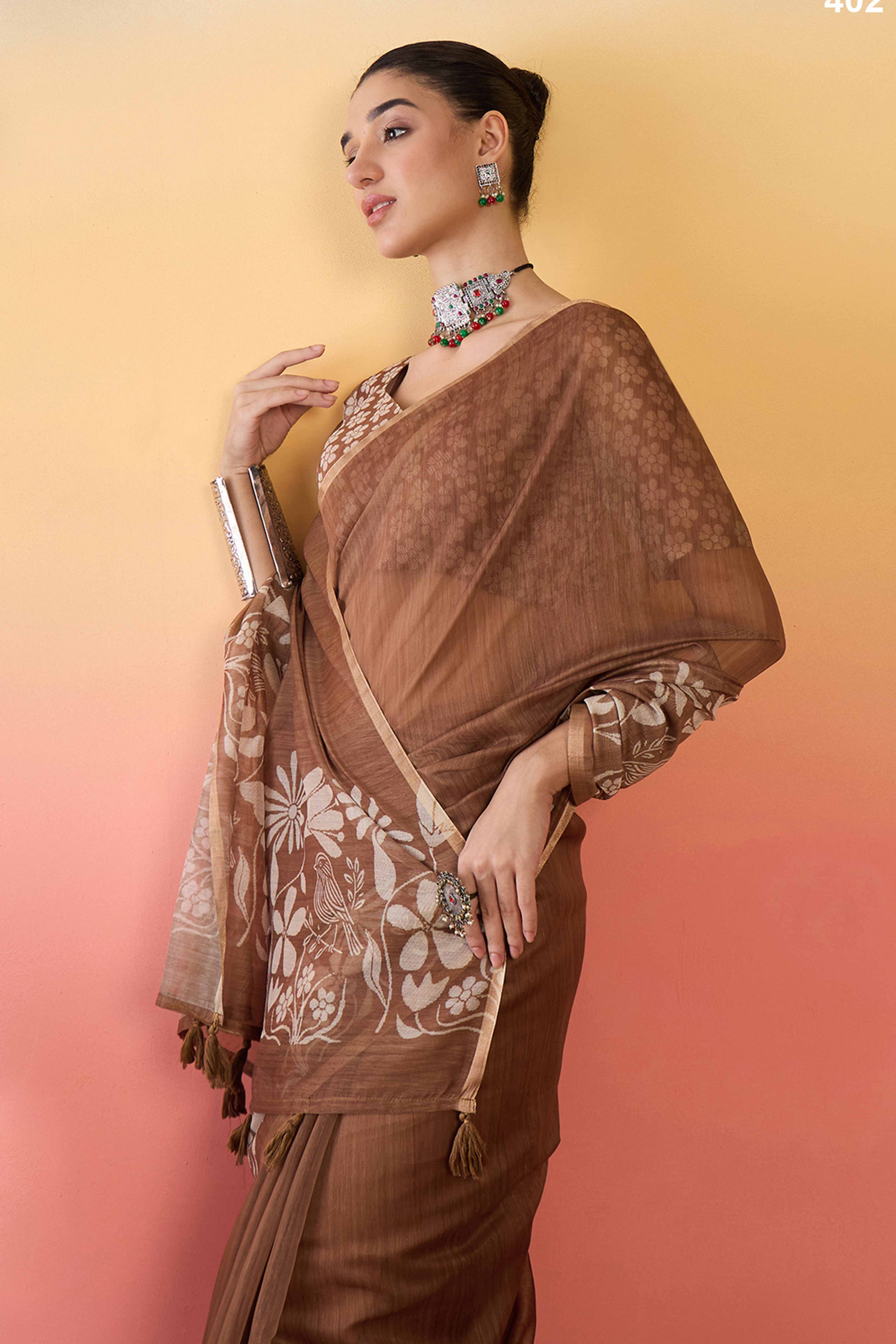 Brown Linen Cotton Saree Featuring Elegant Floral & Bird Prints With Tassel Pallu
