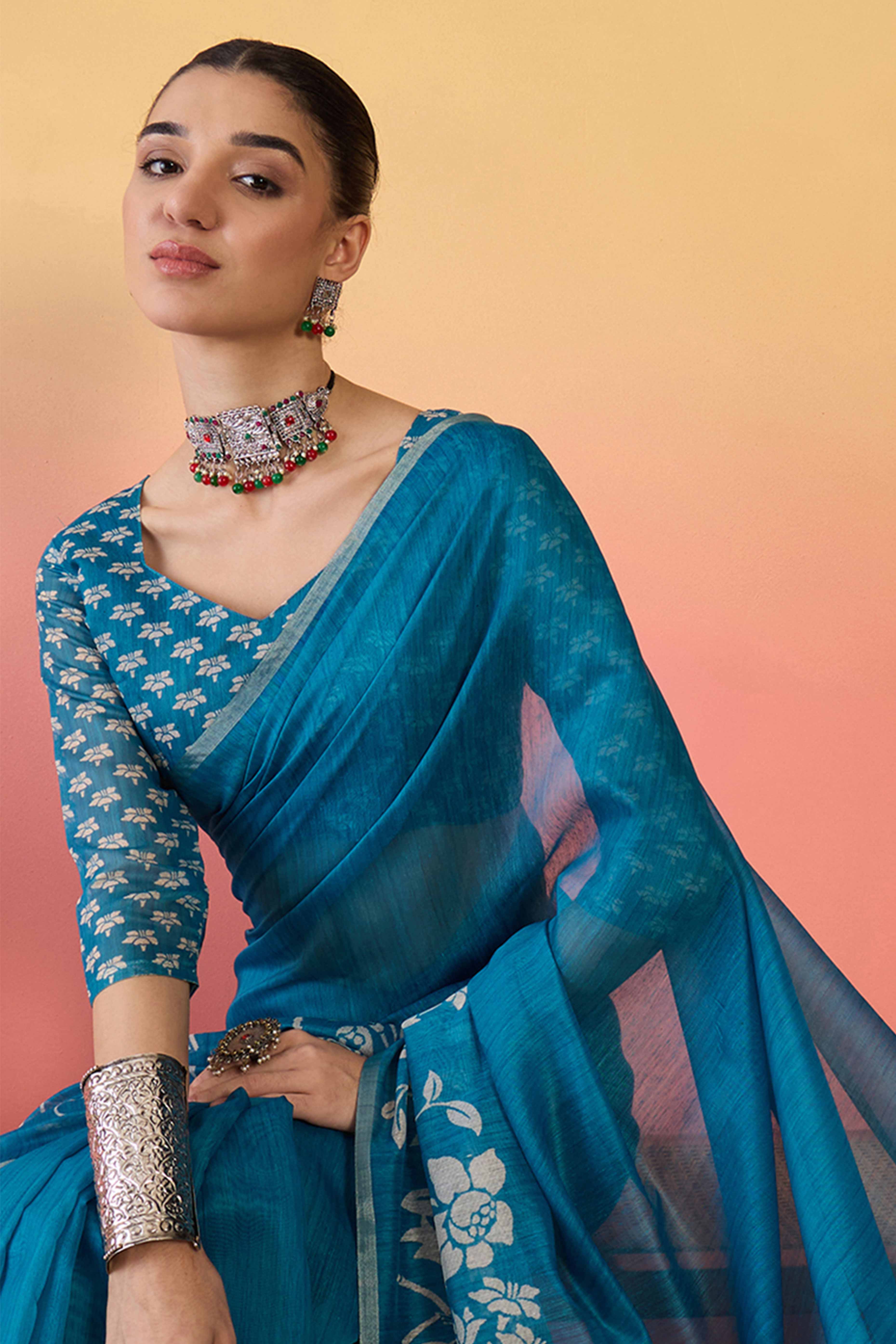 Blue Linen Cotton Saree Featuring Elegant Floral & Bird Prints With Tassel Pallu