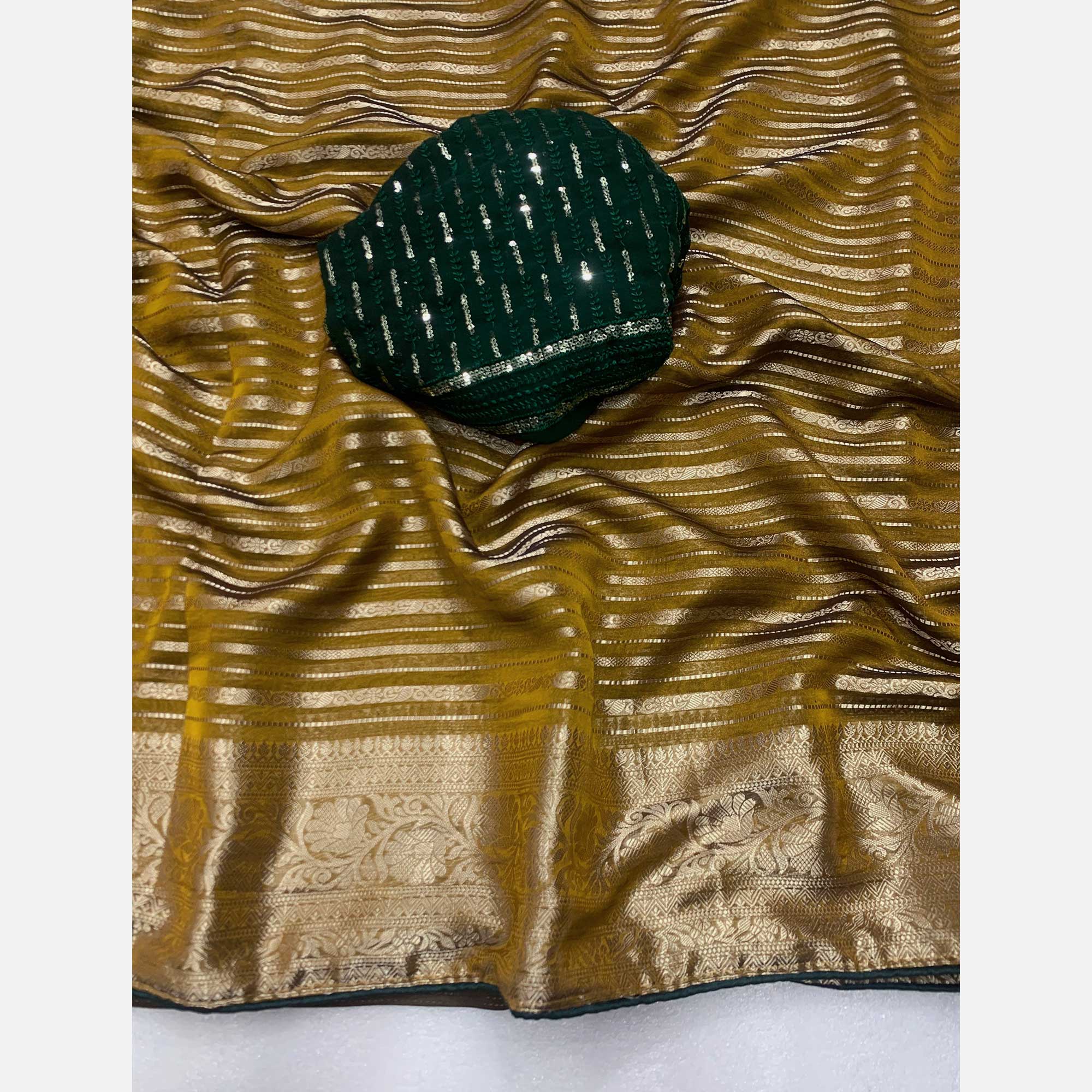 Mustard Woven Georgette Saree With Tassels