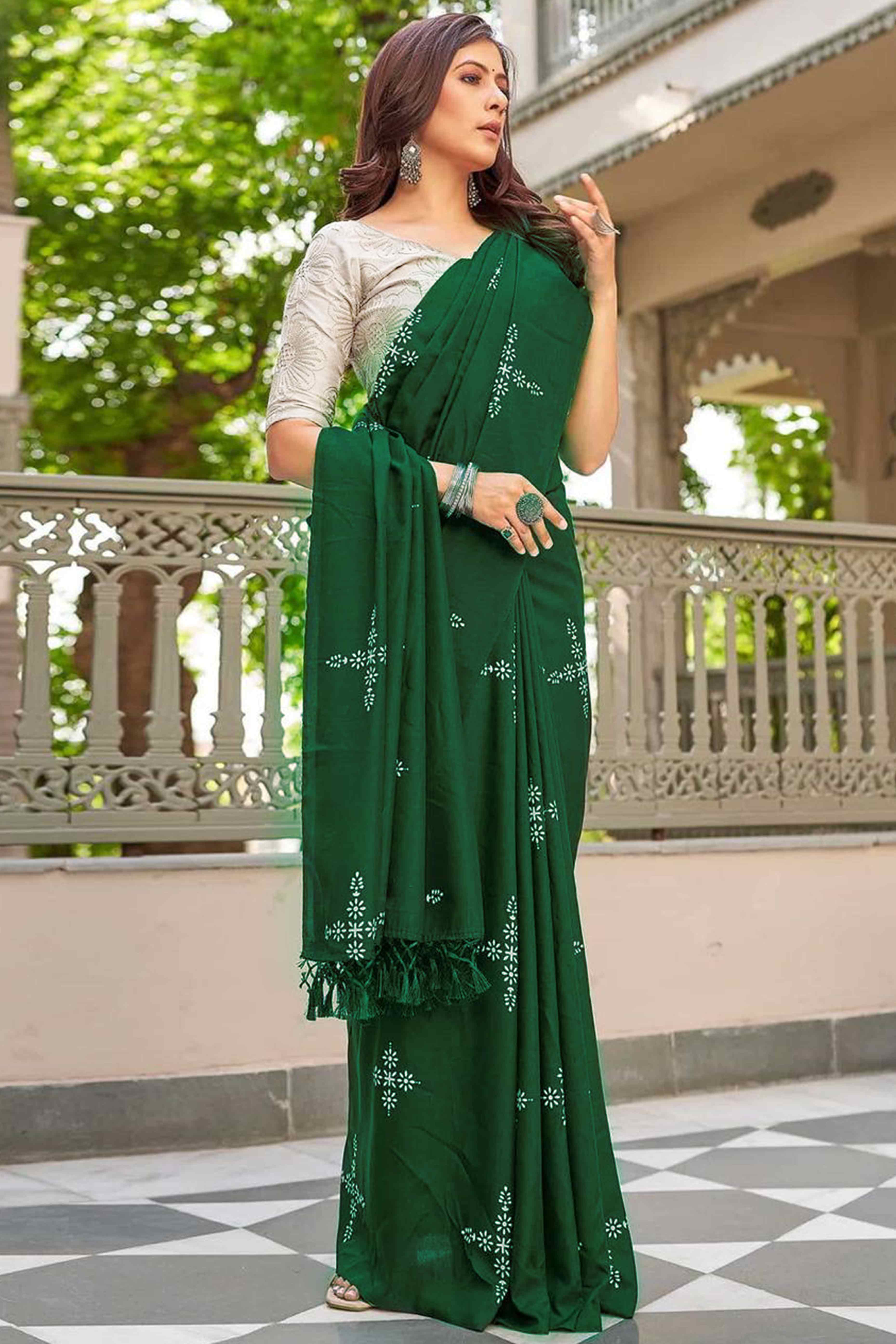 Green Muslin Cotton Silk Saree Adorned With Delicate Floral Prints & Playful Tassels