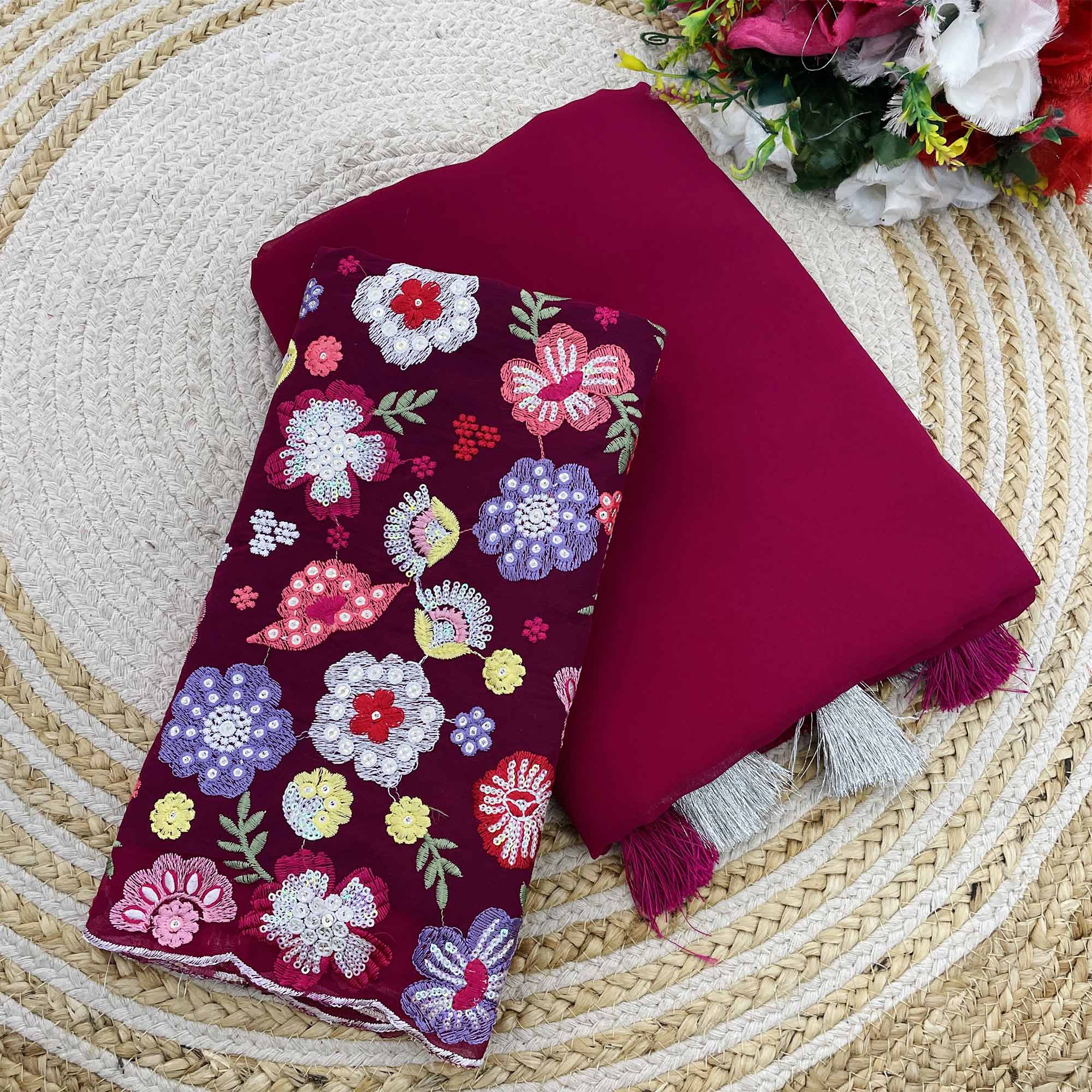 Pink Solid Georgette Saree With Tassels