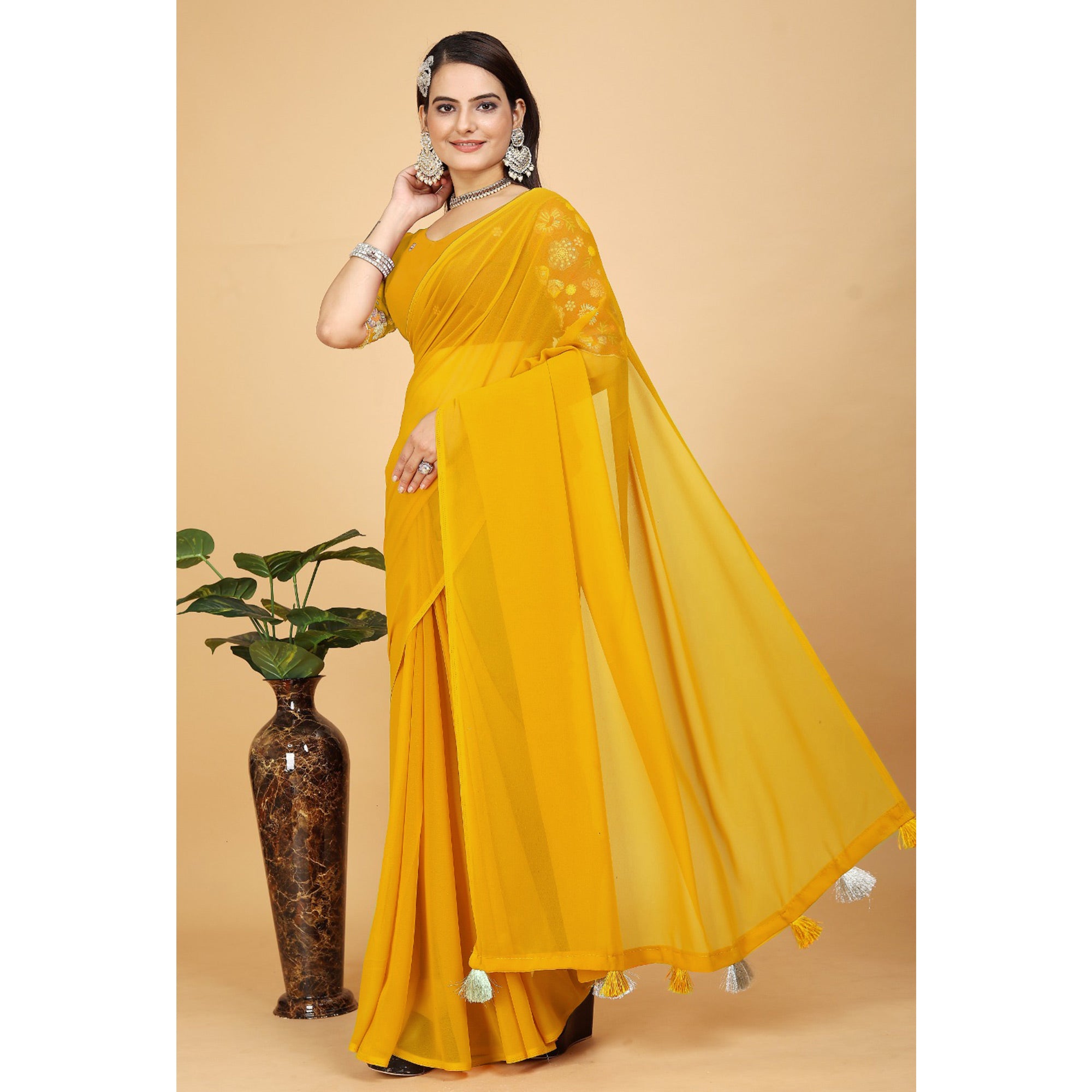 Yellow Solid Georgette Saree With Tassels