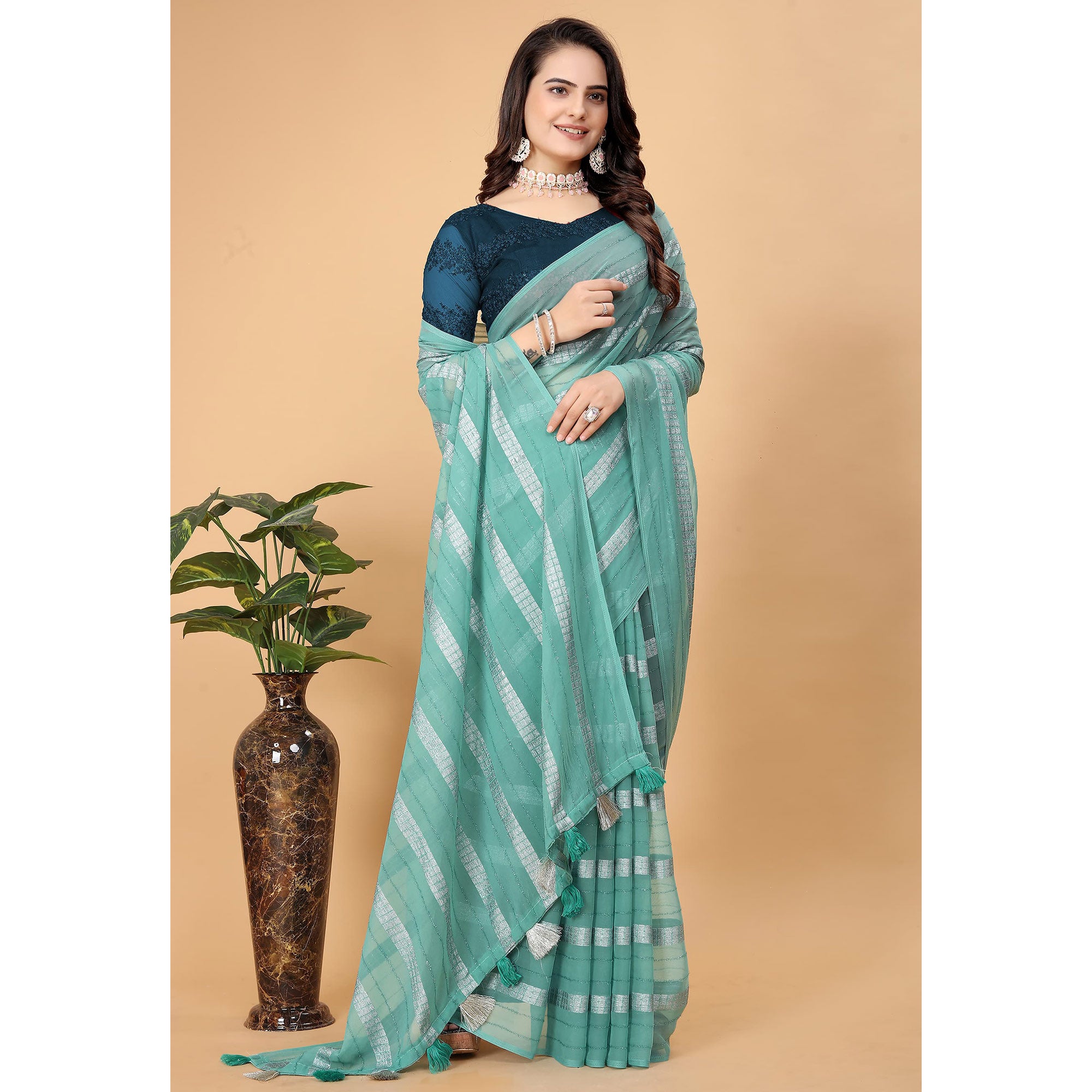 Sea Green Zari Striped Georgette Saree With Tassels