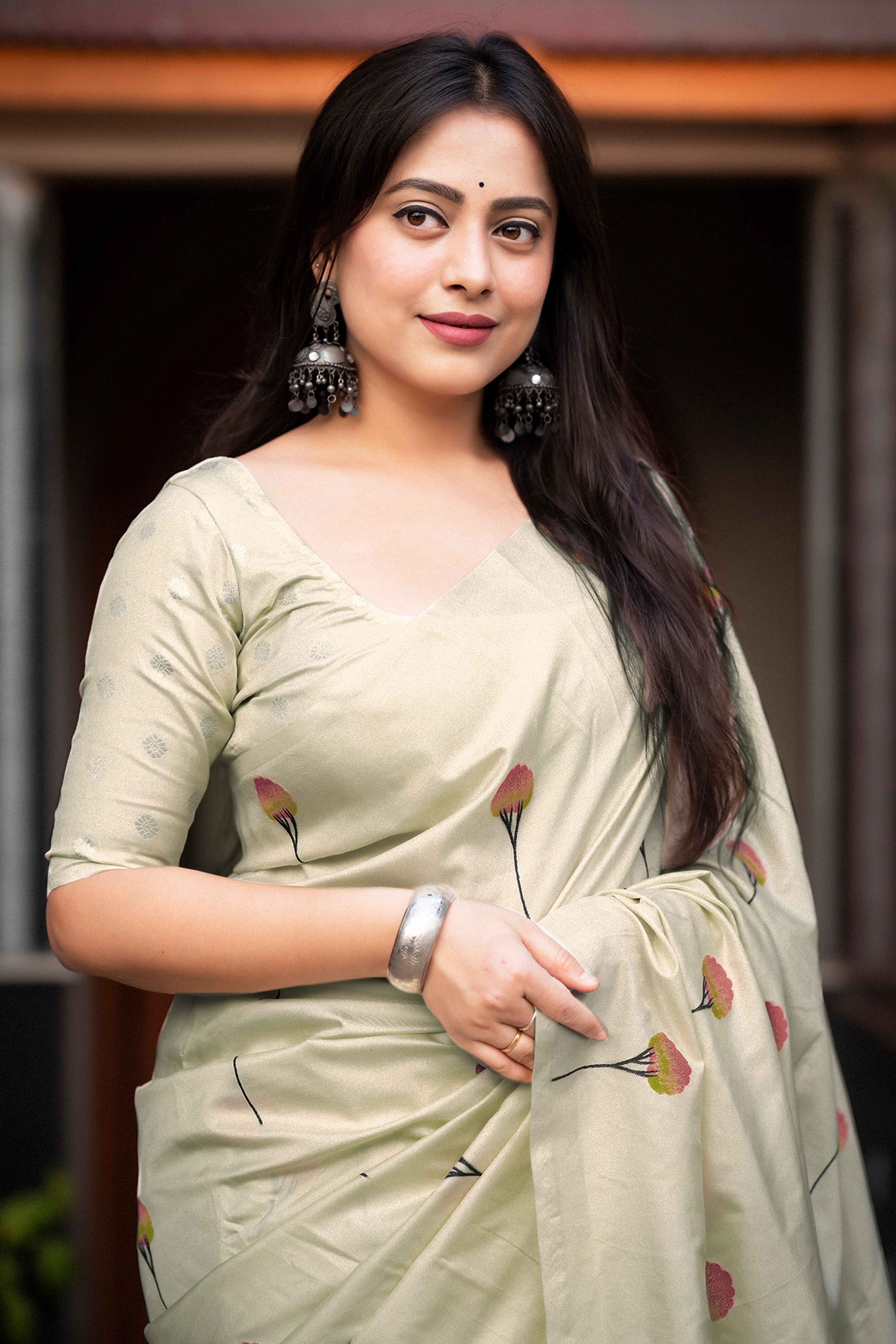 Timeless Cream Banarasi Silk Saree with Floral Zari Weaving & Tassel Border
