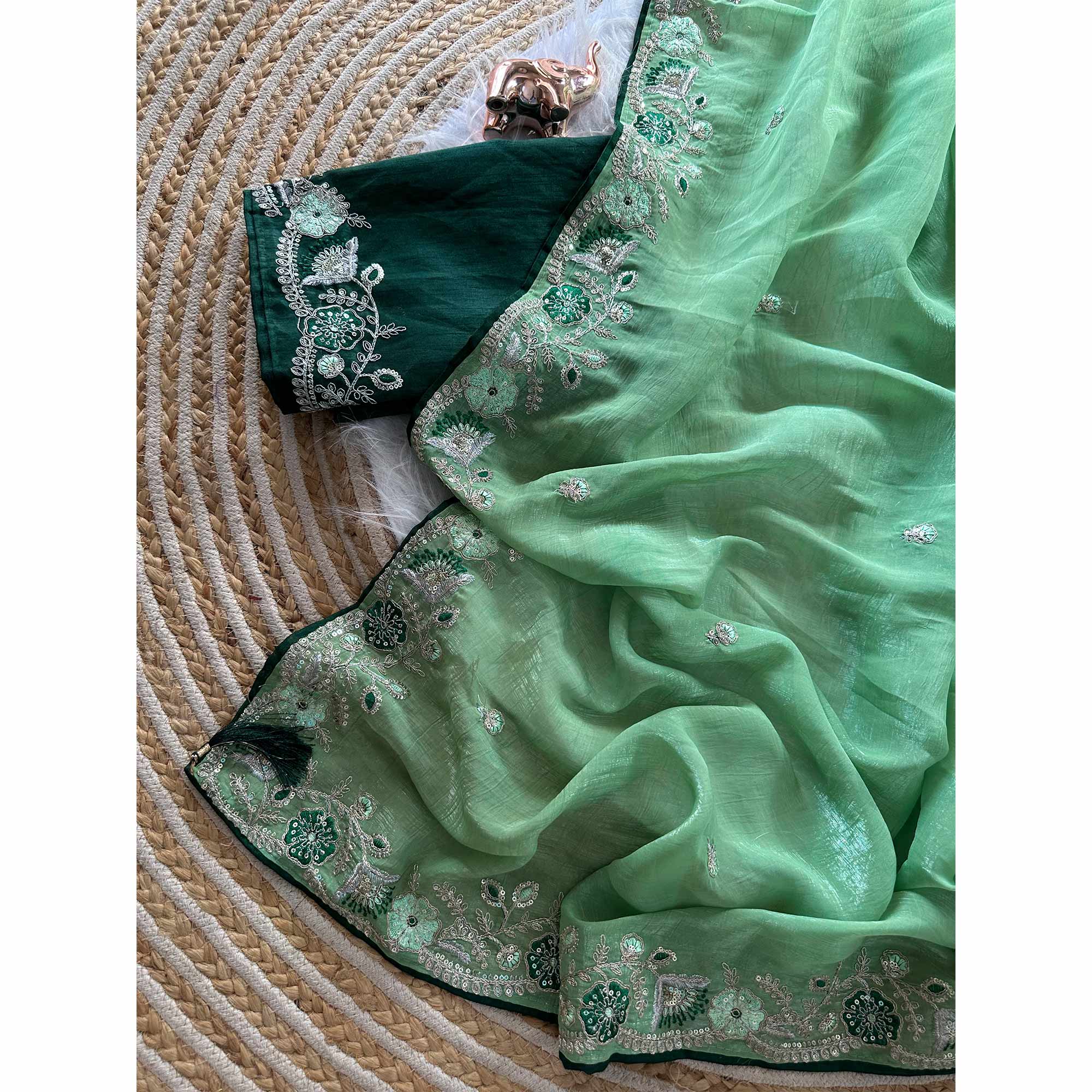 Green Pure Silk Saree Showcasing Floral Sequins Embroidery With A Decorative Tassel Pallu