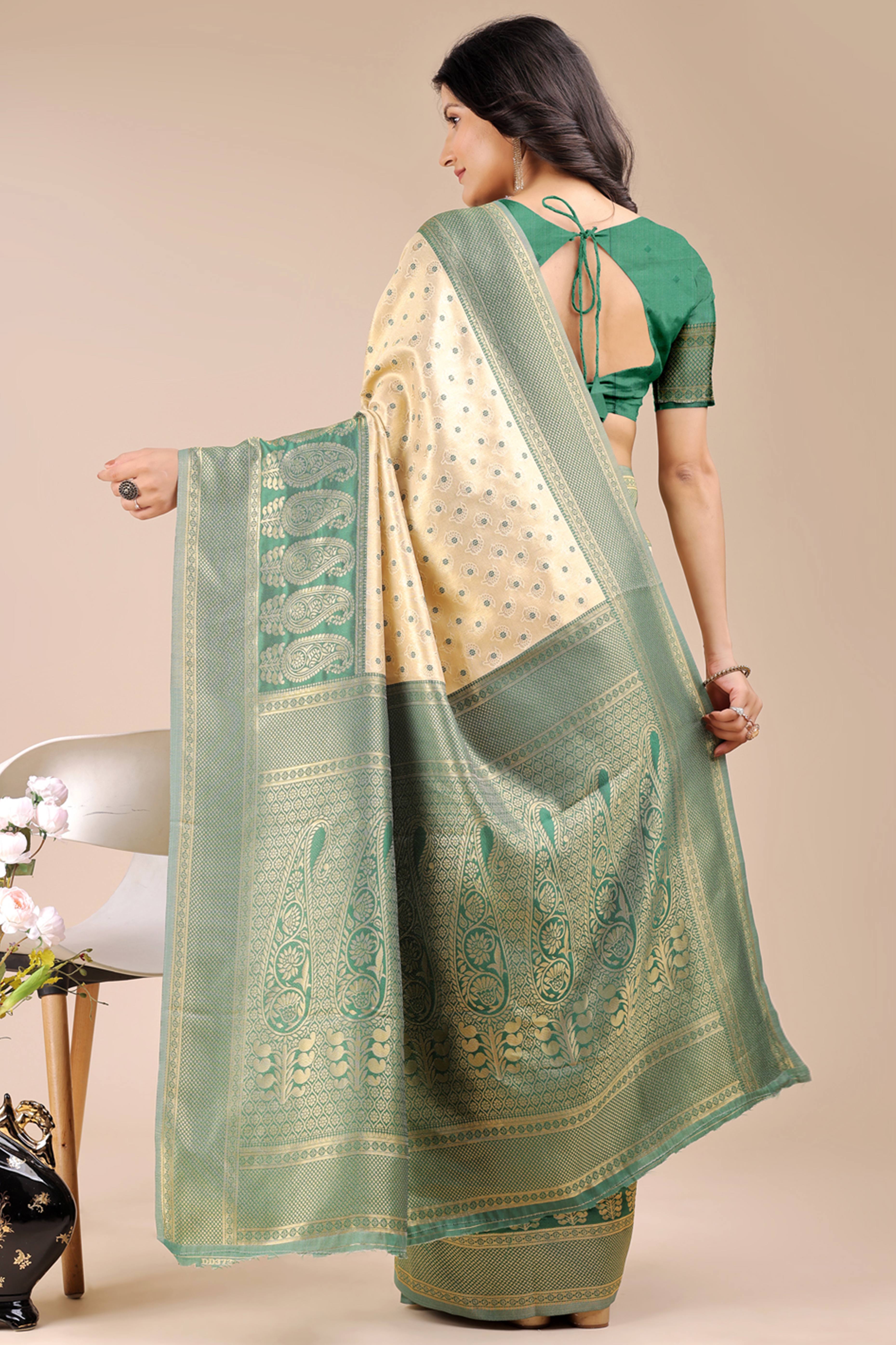 Cream Banarasi Silk Saree Featuring Lustrous Green Floral Zari Weaving and a Rich Contrast Border