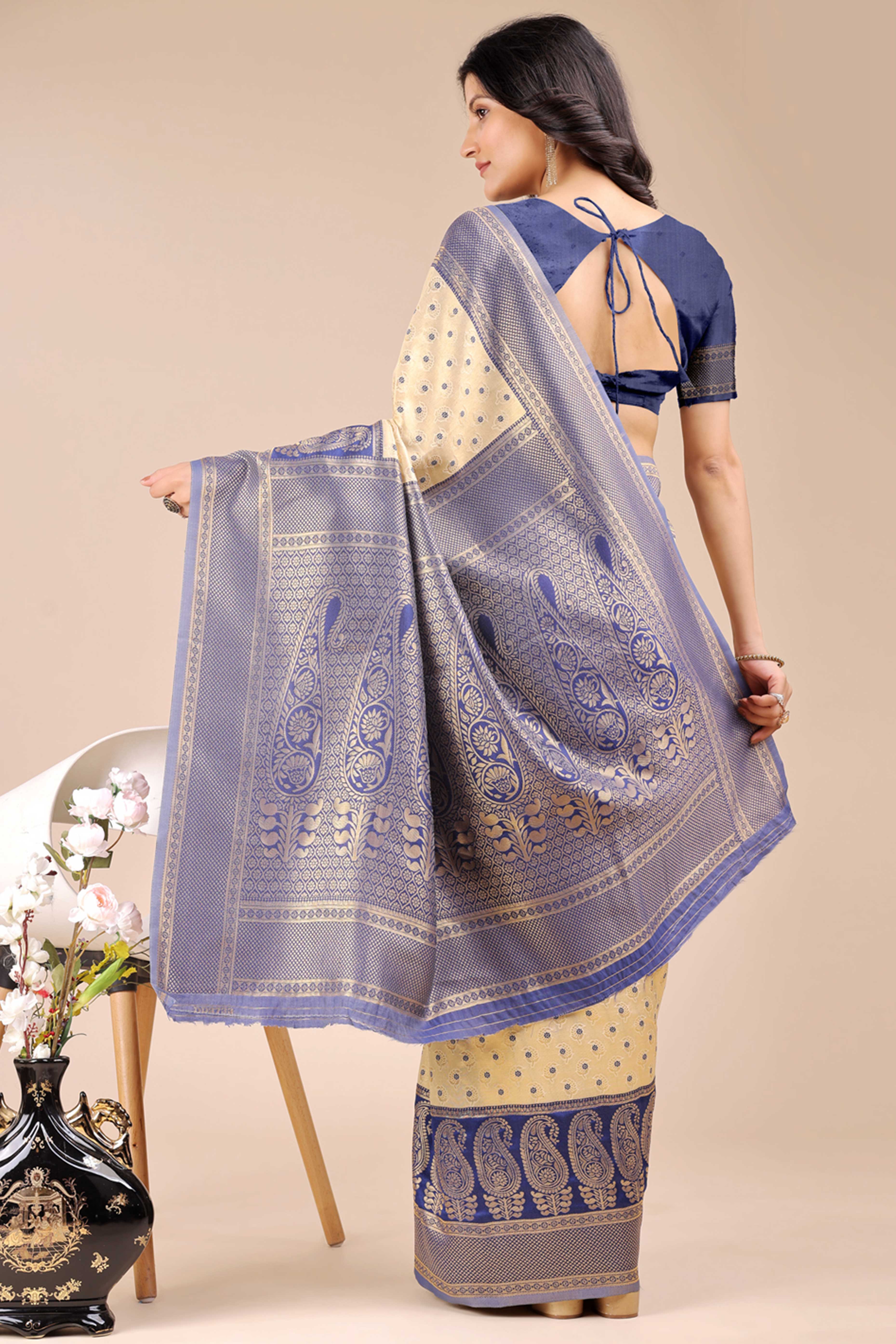 Cream Banarasi Silk Saree Featuring Lustrous Navy Blue Floral Zari Weaving and a Rich Contrast Border