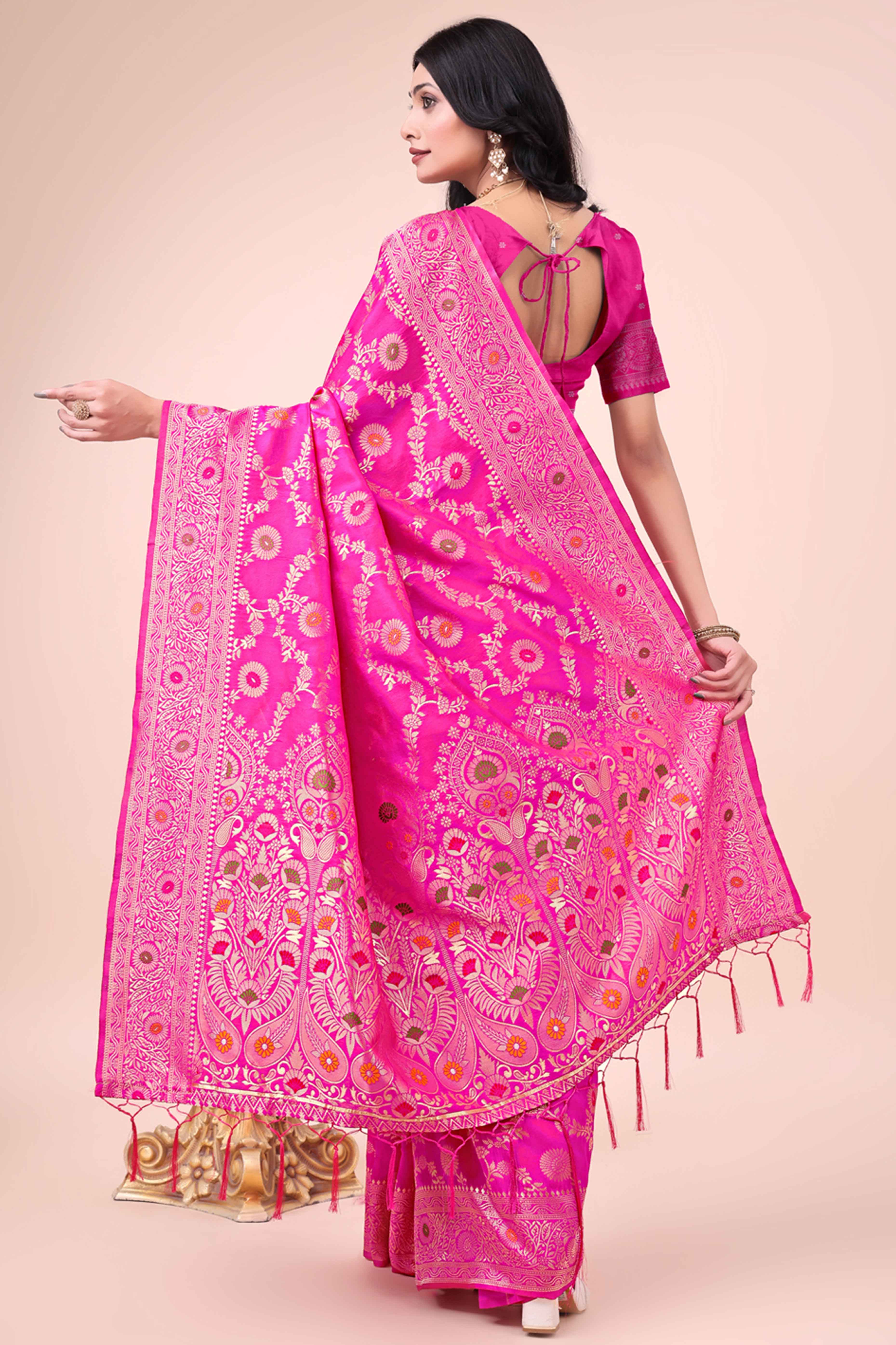 Rani Pink Banarasi Silk Saree With Intricate Floral Weave & Elegant Tassel Accents