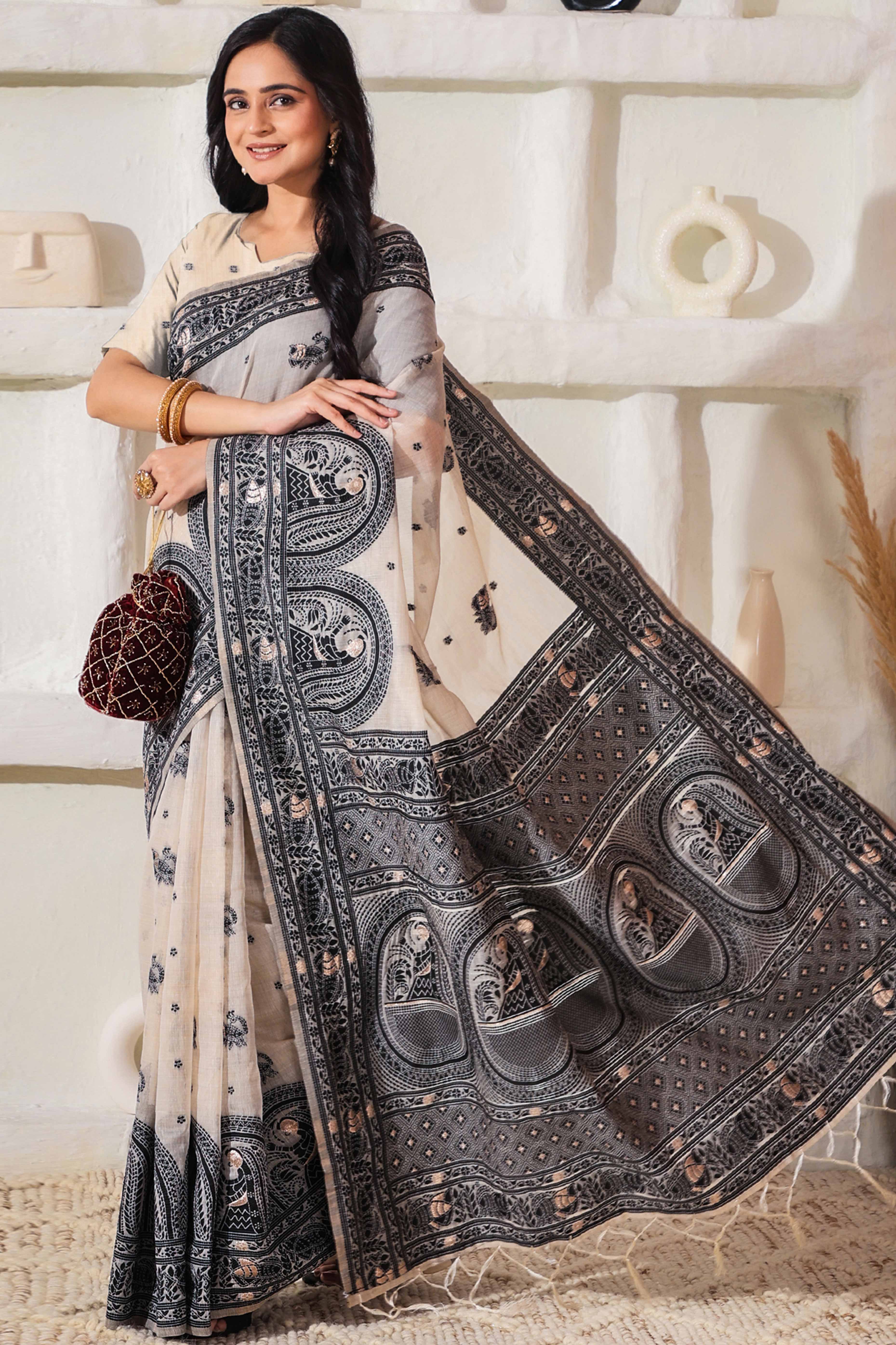Weaving Cream & Black Linen Cotton Saree Adorned With Graceful Tassel Detailing