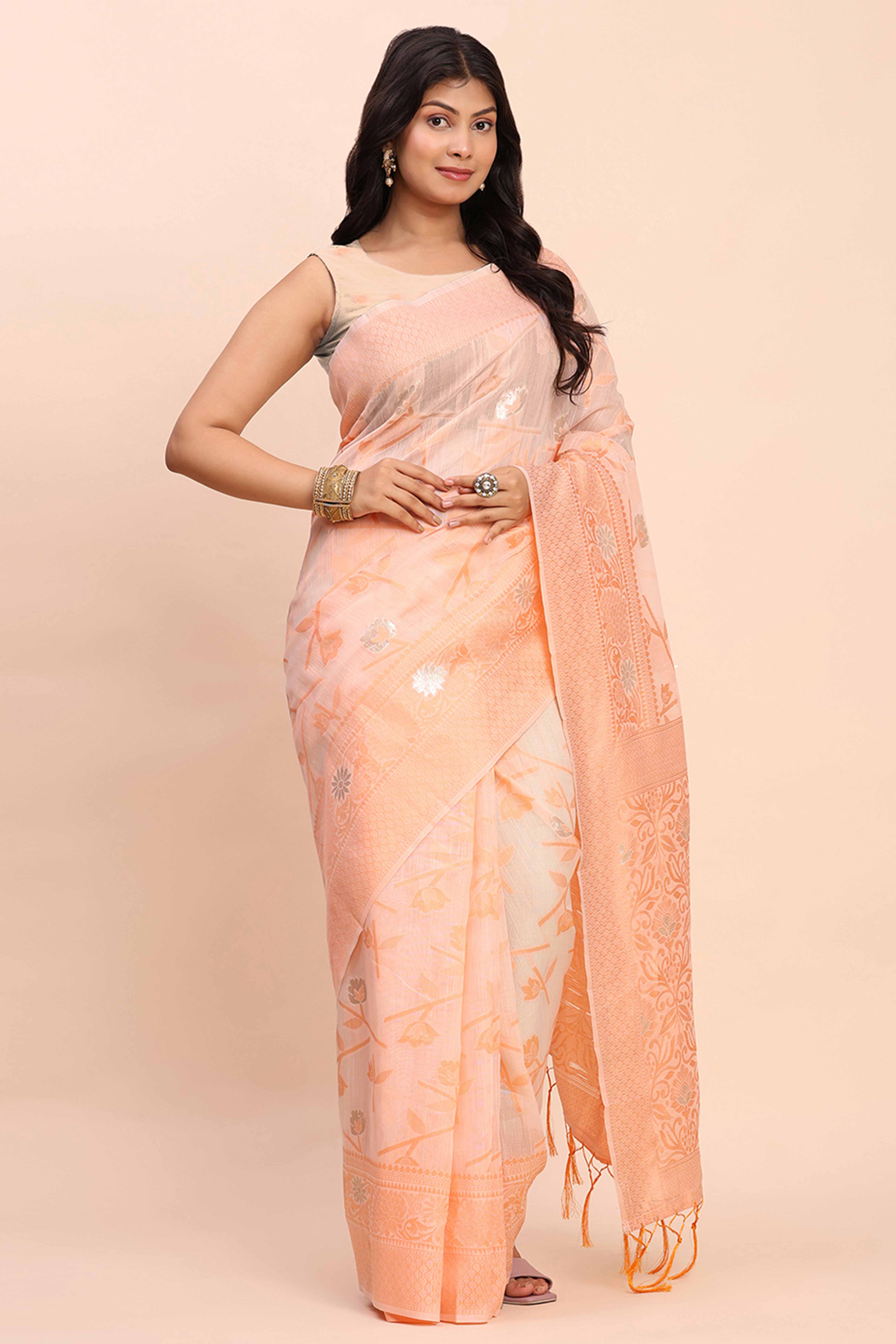 Peach Floral Linen Cotton Saree Accented With Zari Weaving & Tassel Pallu Elegance