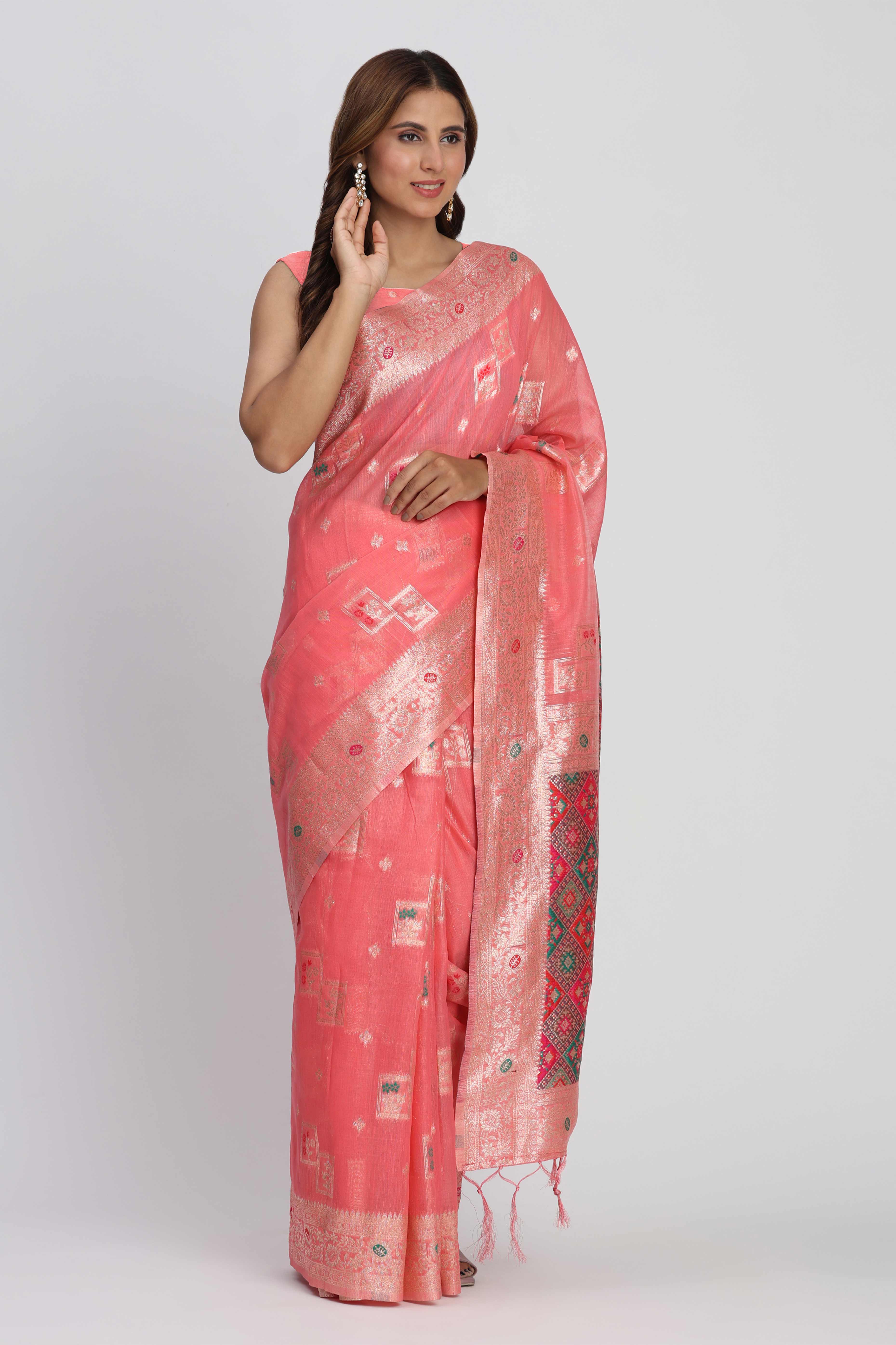 Floral Zari Weaving Brings Regal Beauty To This Coral Pink Linen Cotton Saree With Tassel Accents
