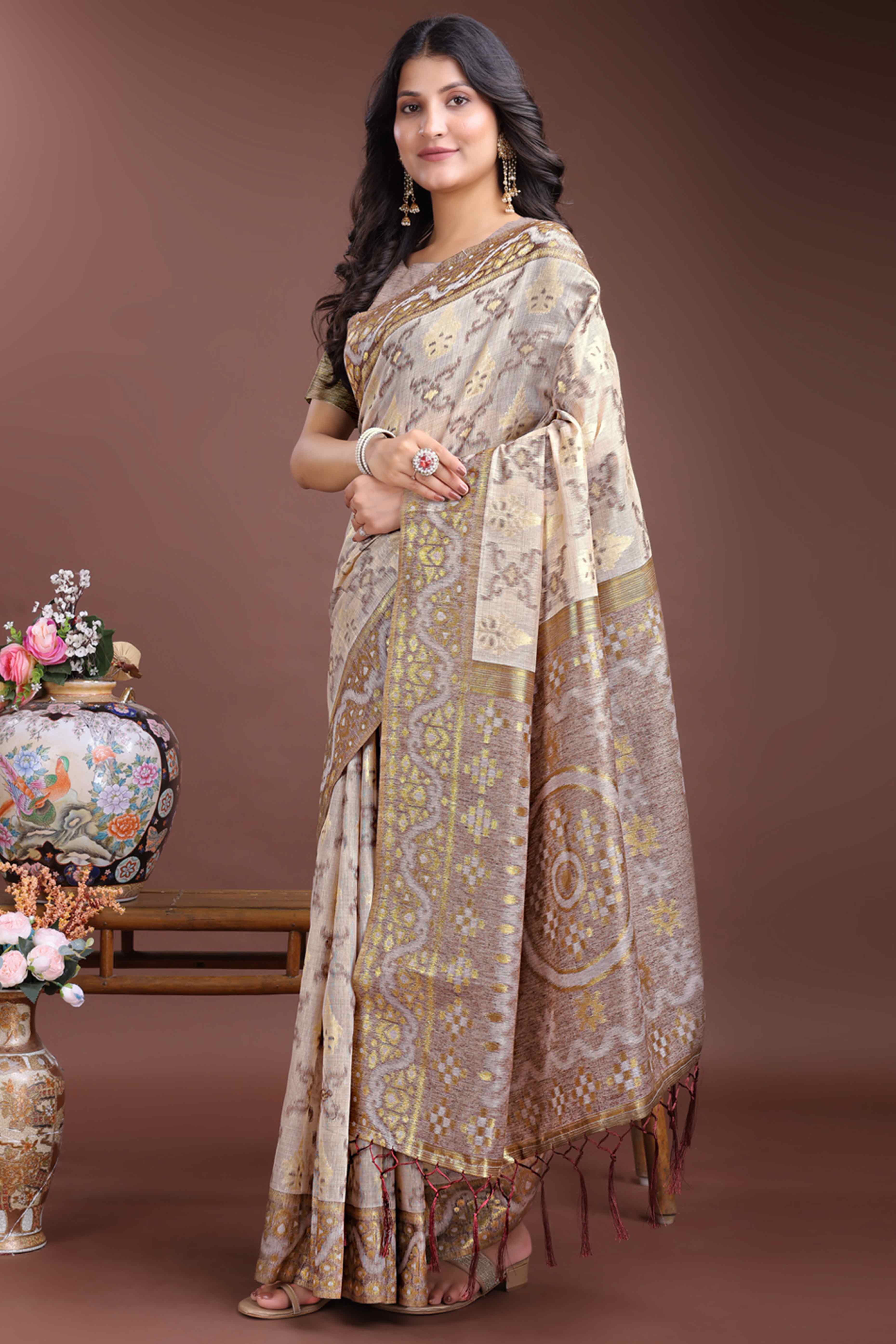 Sophisticated Brown Traditional Ikkat Style Zari Weaving Cotton Blend Saree Adorned with Elegant Tassels
