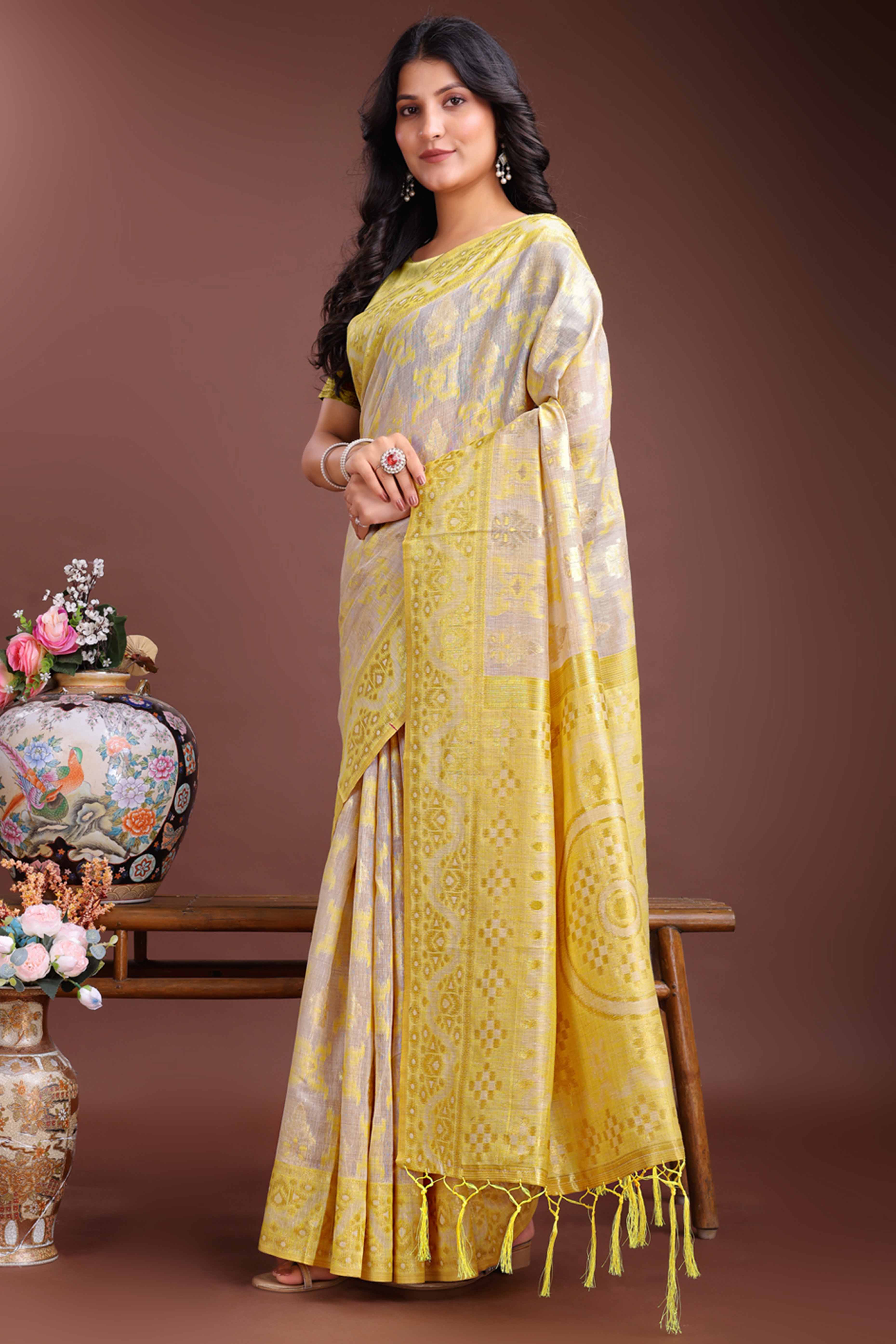 Radiant Yellow Traditional Ikkat Style Zari Weaving Cotton Blend Saree with Vibrant Tassel Embellishments