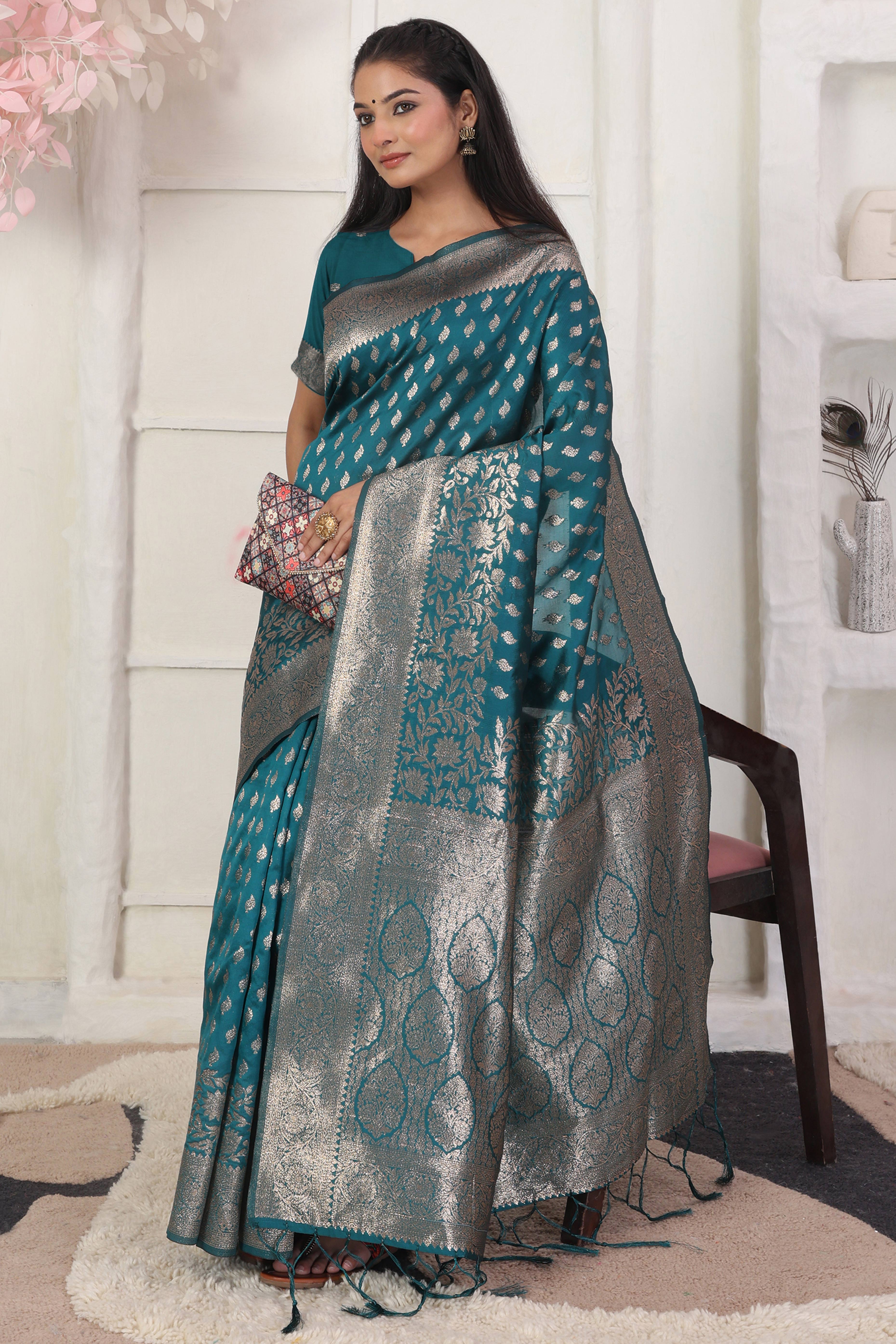 Rama Blue Traditional Lichi Silk Blend Saree Enhanced With Floral Zari Weaving & Tassel Pallu