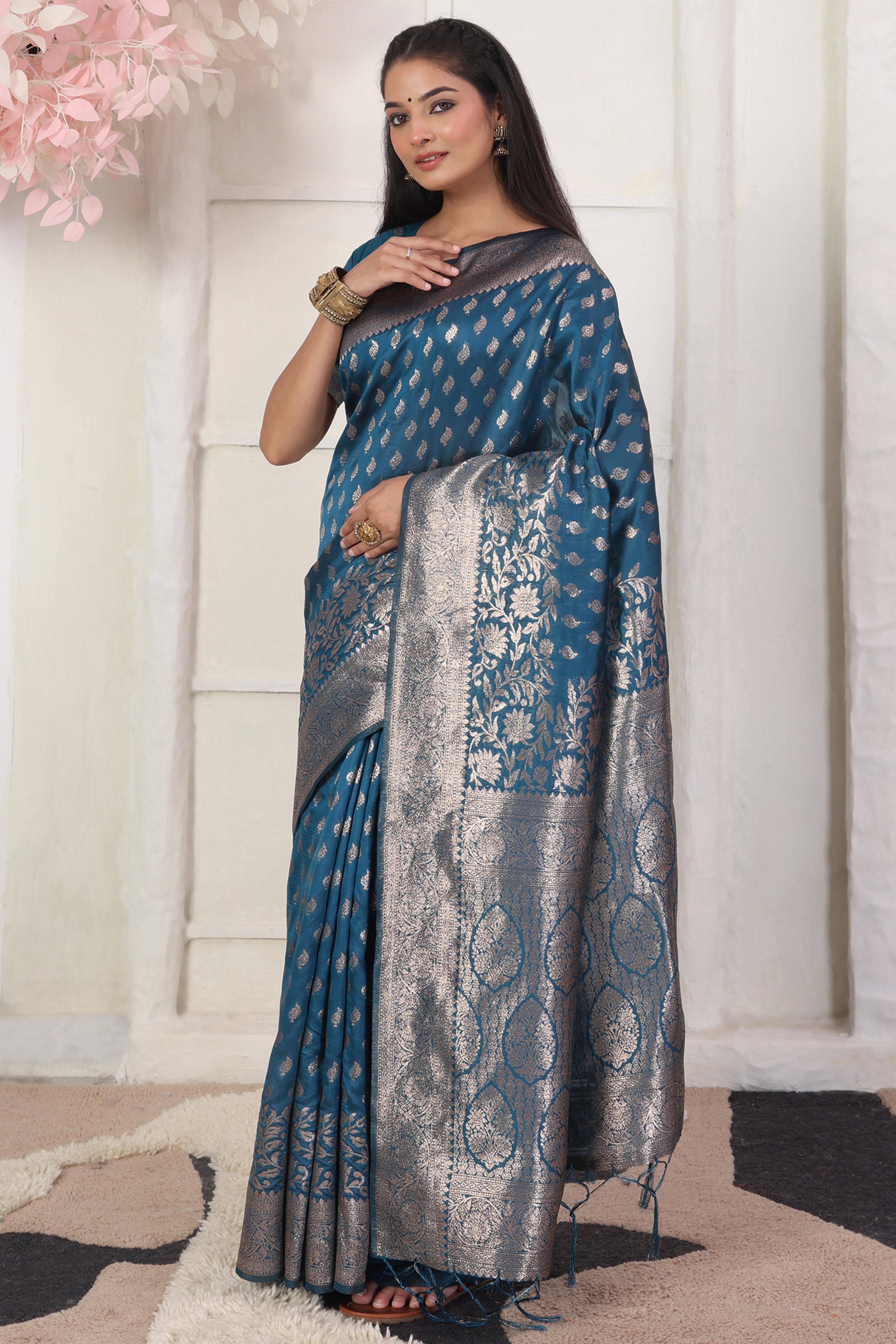 Blue Traditional Lichi Silk Blend Saree Enhanced With Floral Zari Weaving & Tassel Pallu