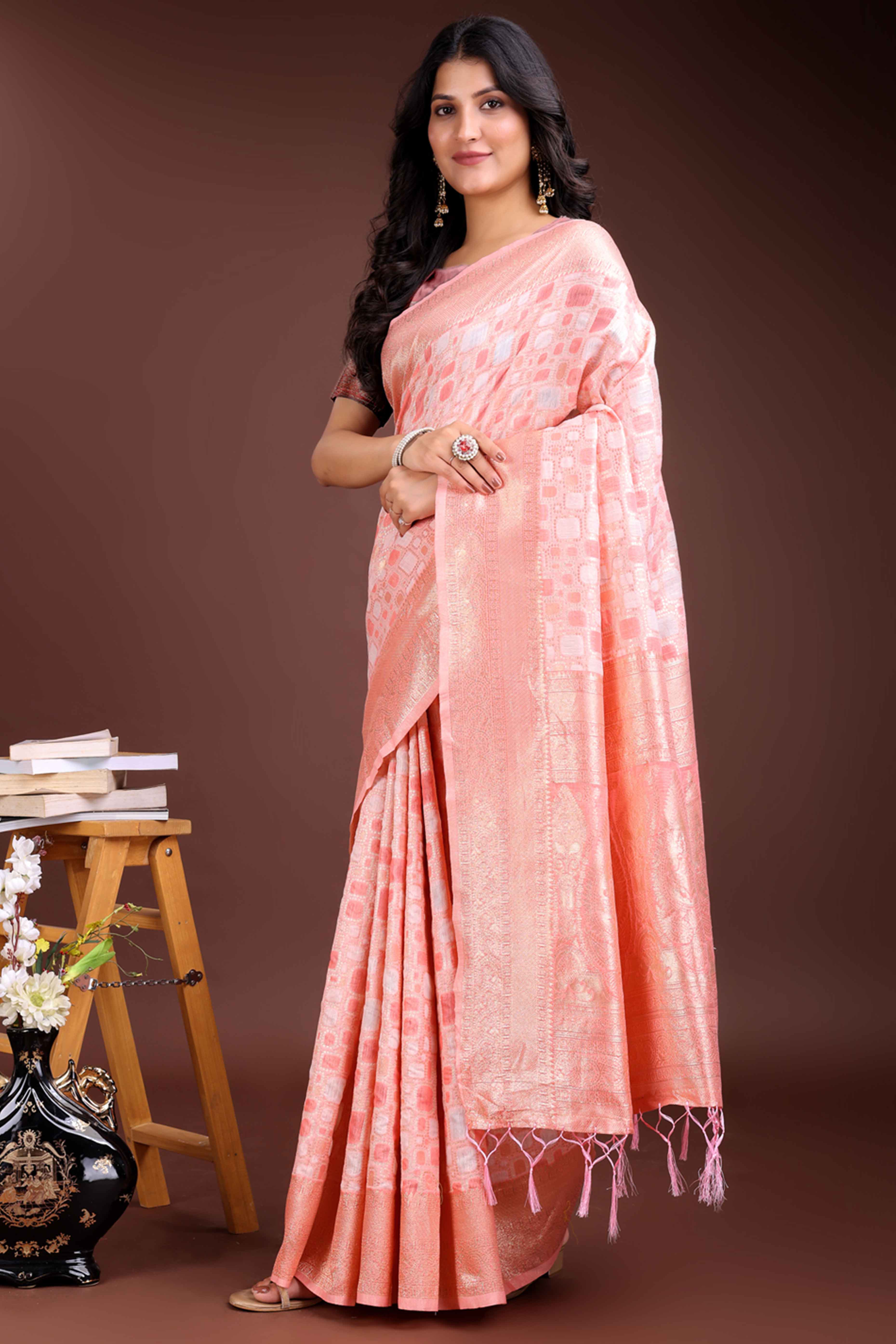 Delightful Peach Geometric Style Zari Weaving Cotton Blend Saree Embellished with Stylish Tassels