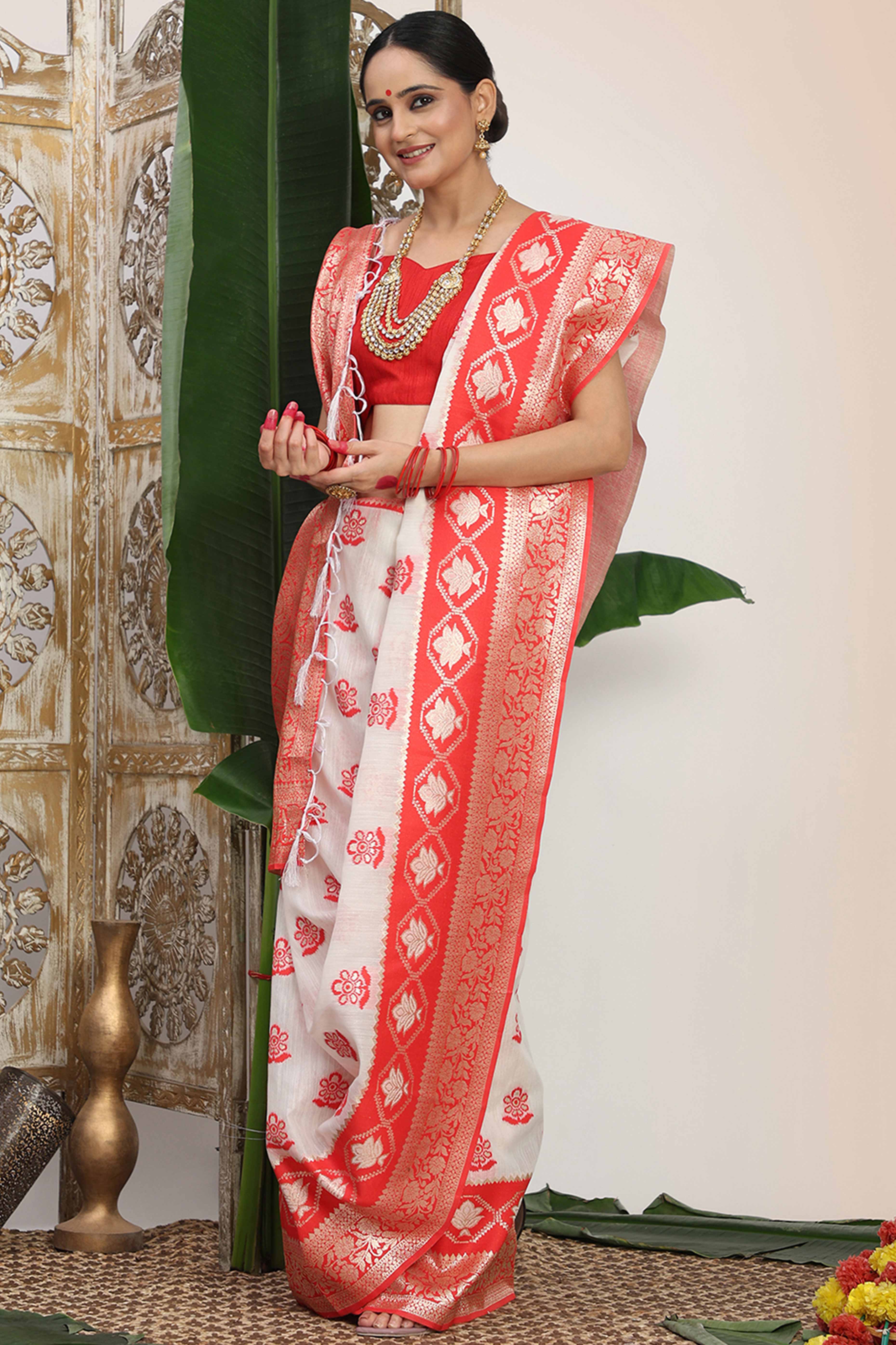Chic White & Red Saree In Linen Cotton Flaunting Traditional Zari Weaving And A Tasselled Edge