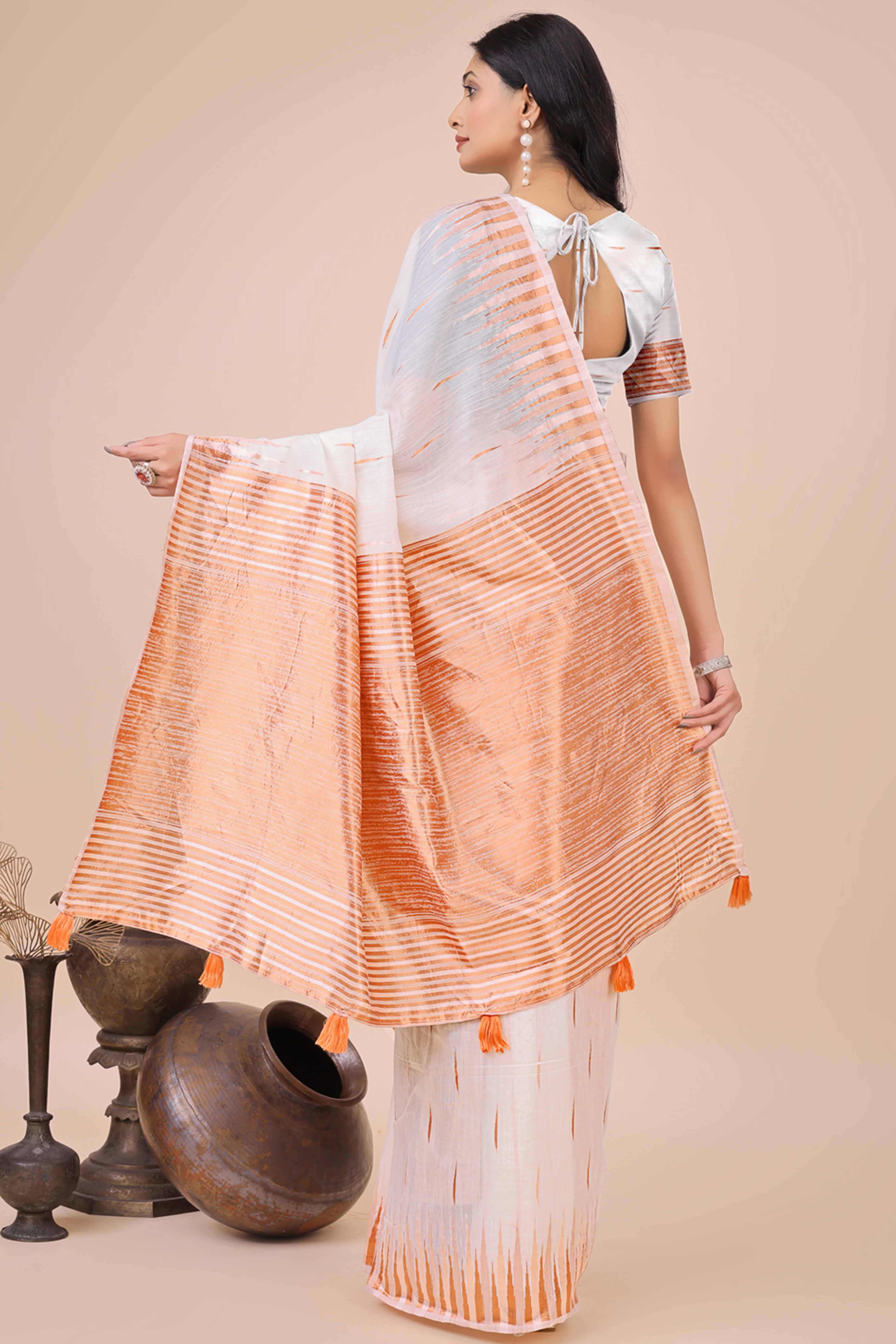 White Saree In Linen Cotton With Exquisite Zari Weaving & Subtle Tassel Border