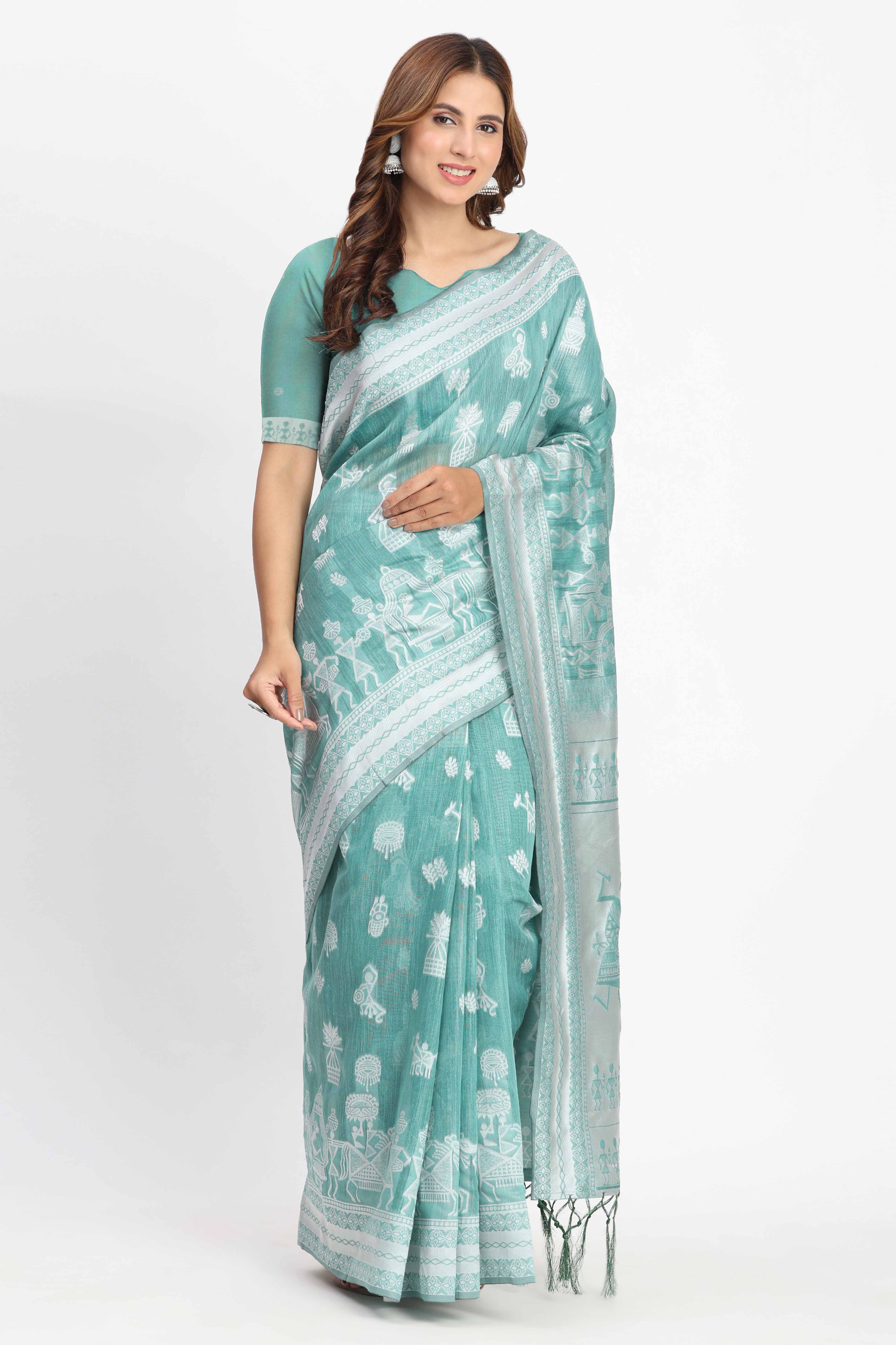 Pastel Sea Green Linen Cotton Saree Showcasing Warli Motifs In Zari Weaving With Tassel Pallu