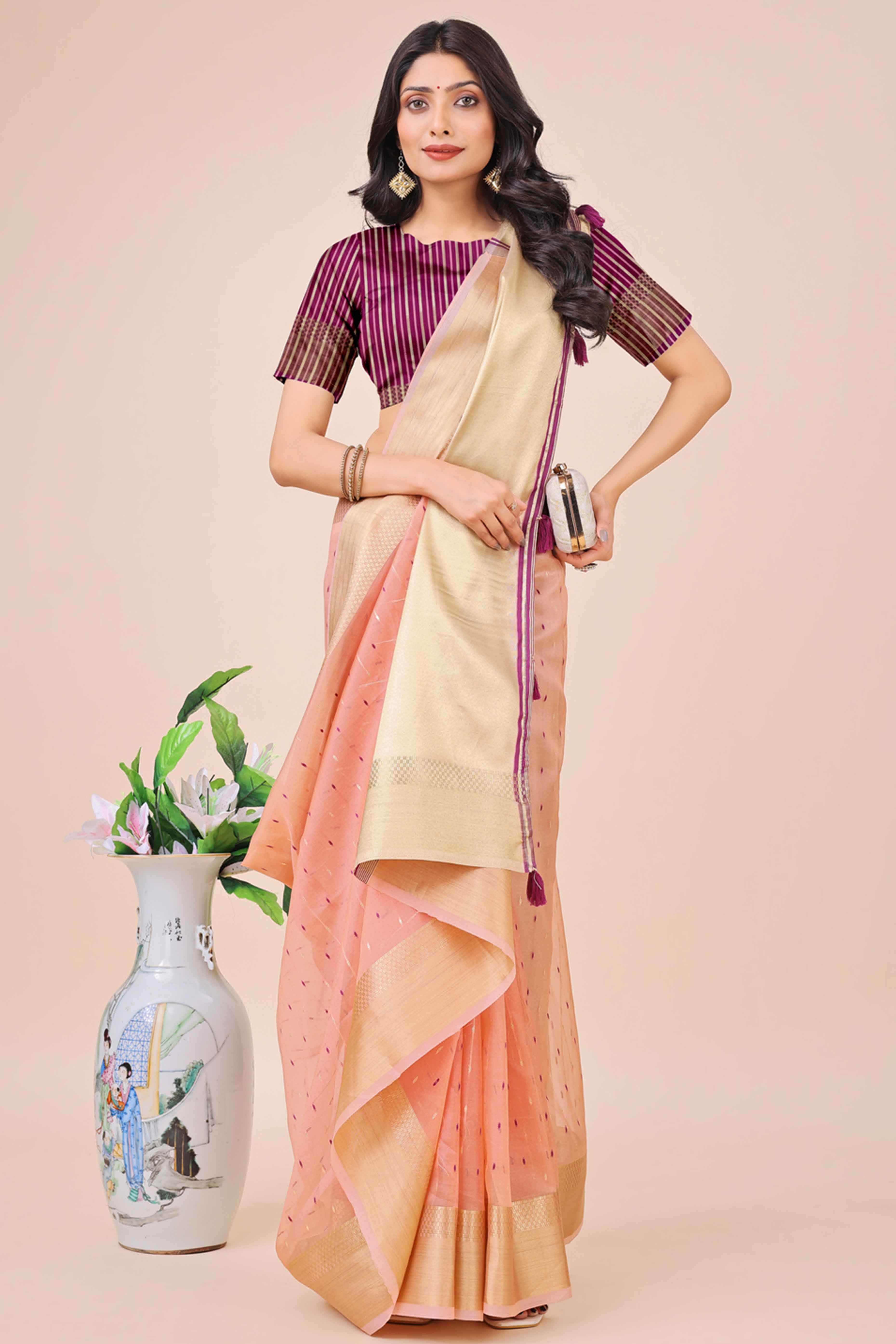 Light Pink Organza Saree Adorned With Fine Zari Weaving & Stylish Tassel Edging