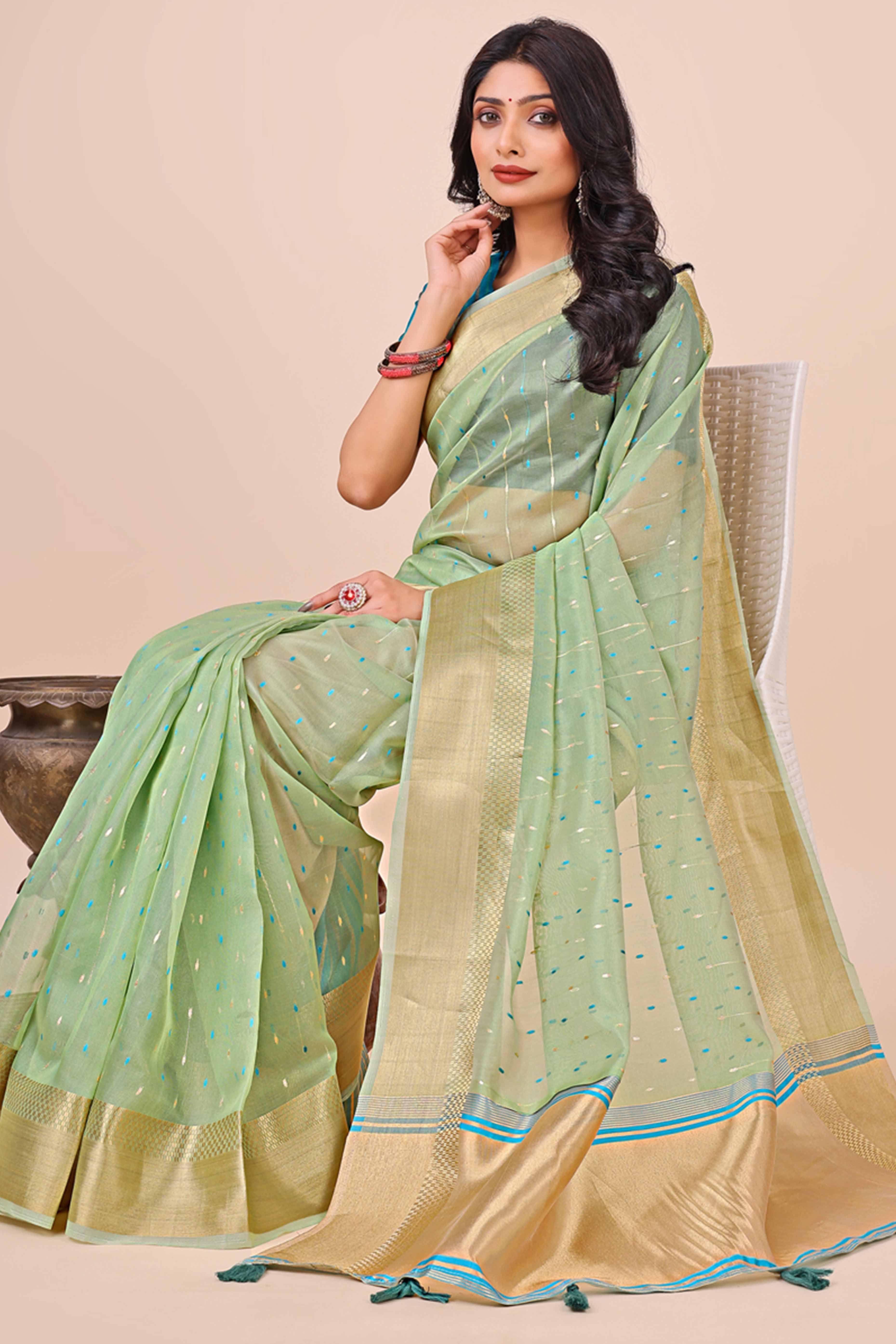 Pista Green Organza Saree Adorned With Fine Zari Weaving & Stylish Tassel Edging