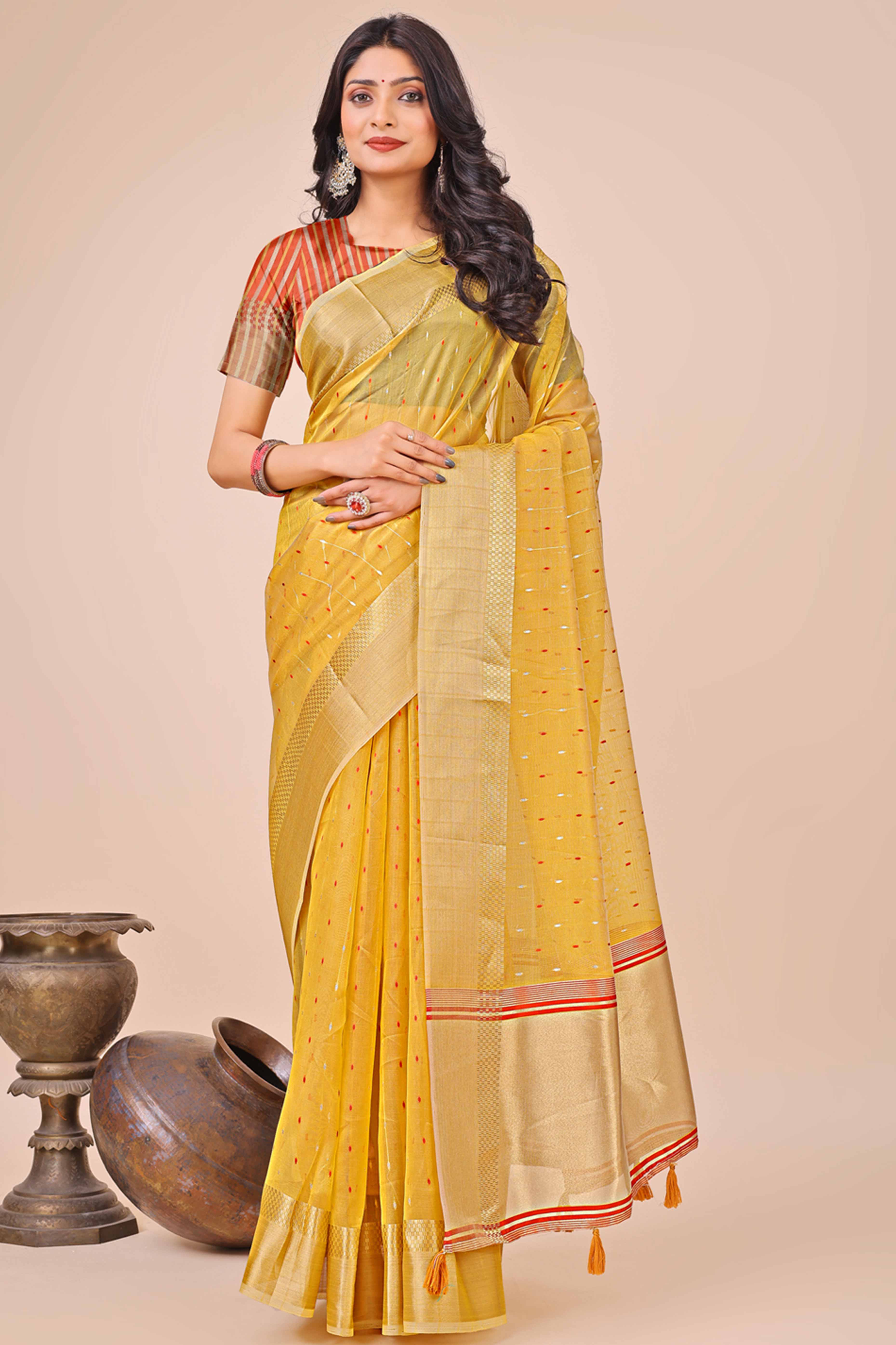 Yellow Organza Saree Adorned With Fine Zari Weaving & Stylish Tassel Edging