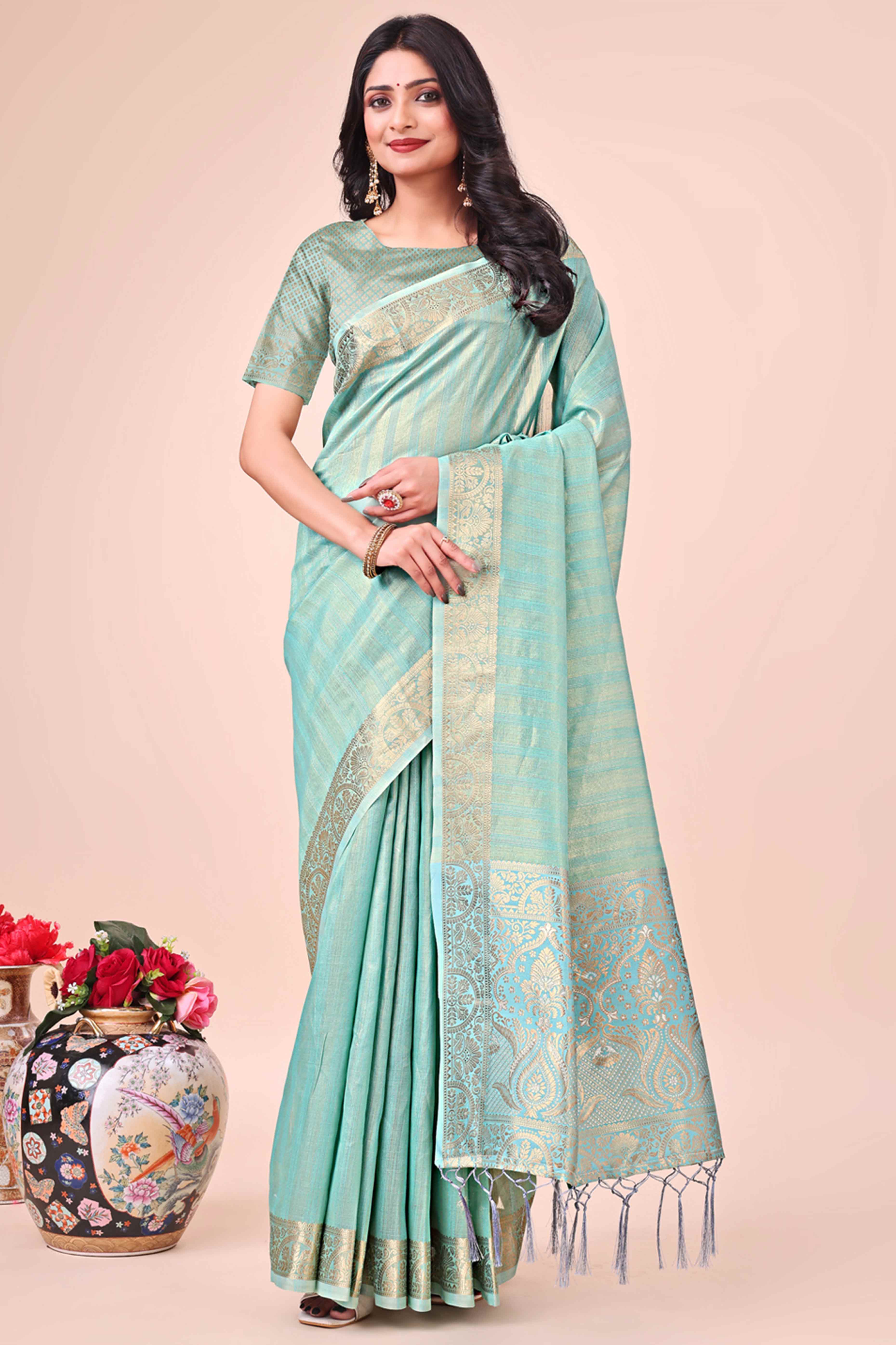 Turquoise Organza Saree With Floral Zari Weave & Tassel Accents