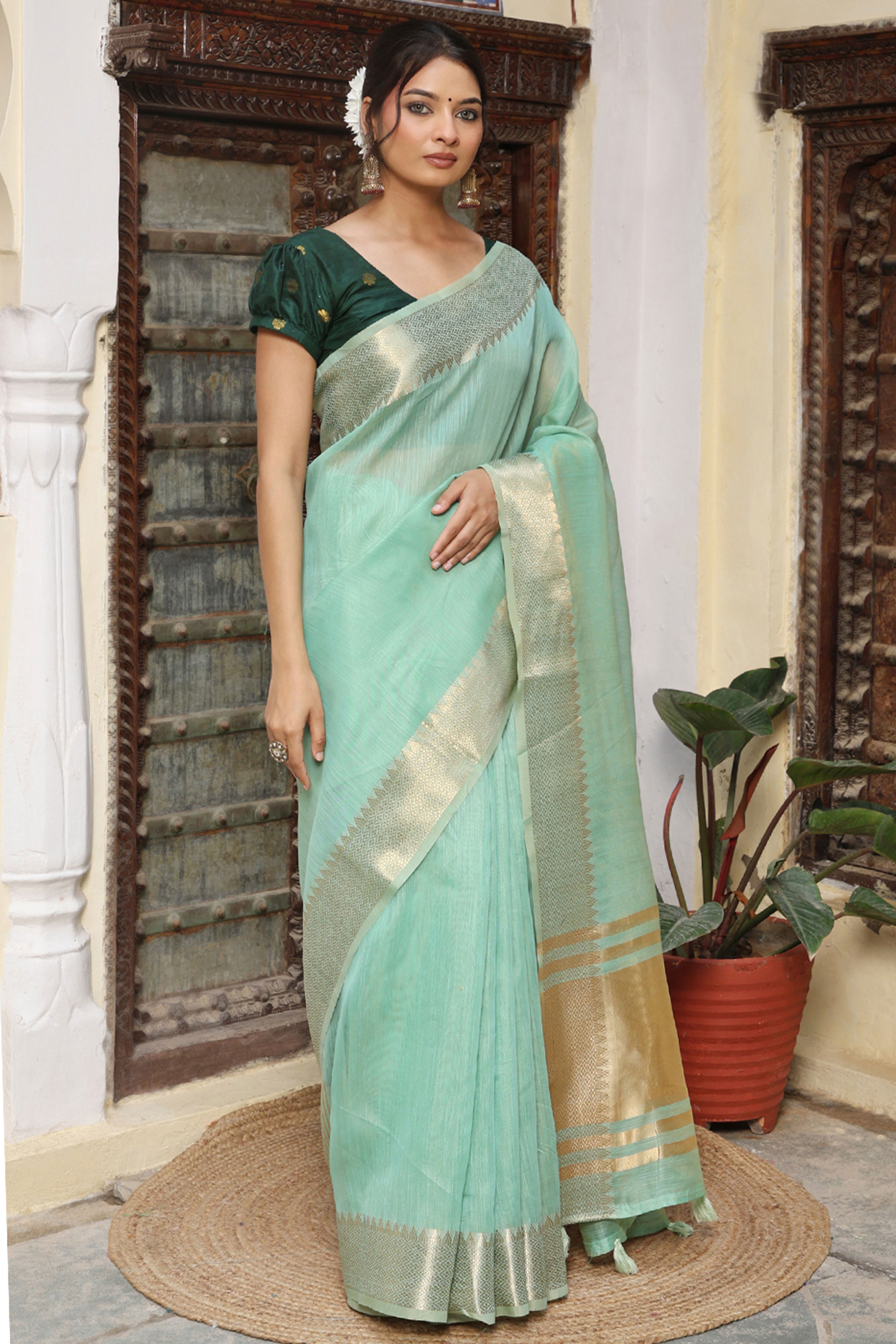 Trendy Turquoise Cotton Blend Saree Showcasing Elegant Zari Weaving & Tassel Border Pallu