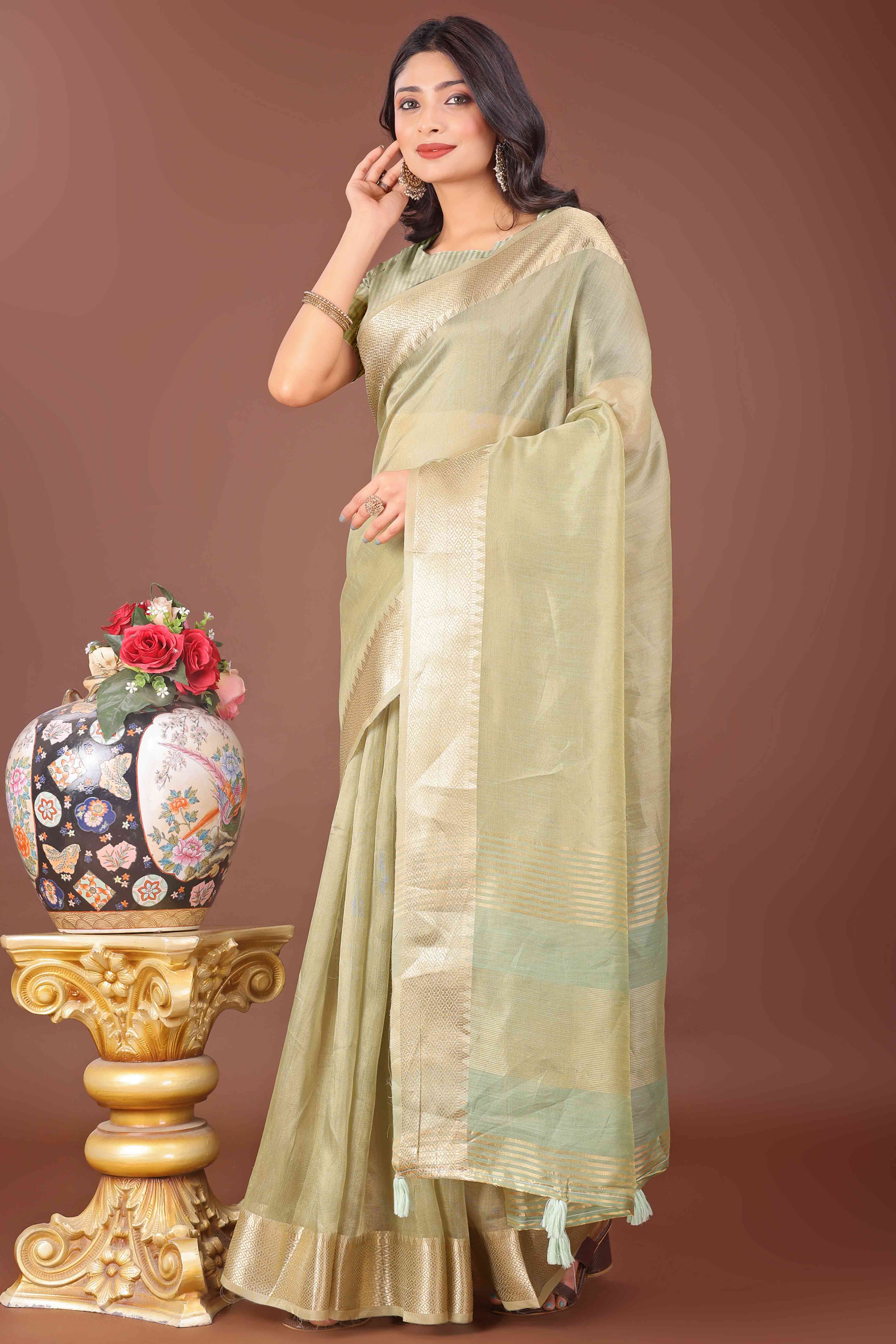 Light Green Solid With Zari Woven Organza Saree With Tassel Border