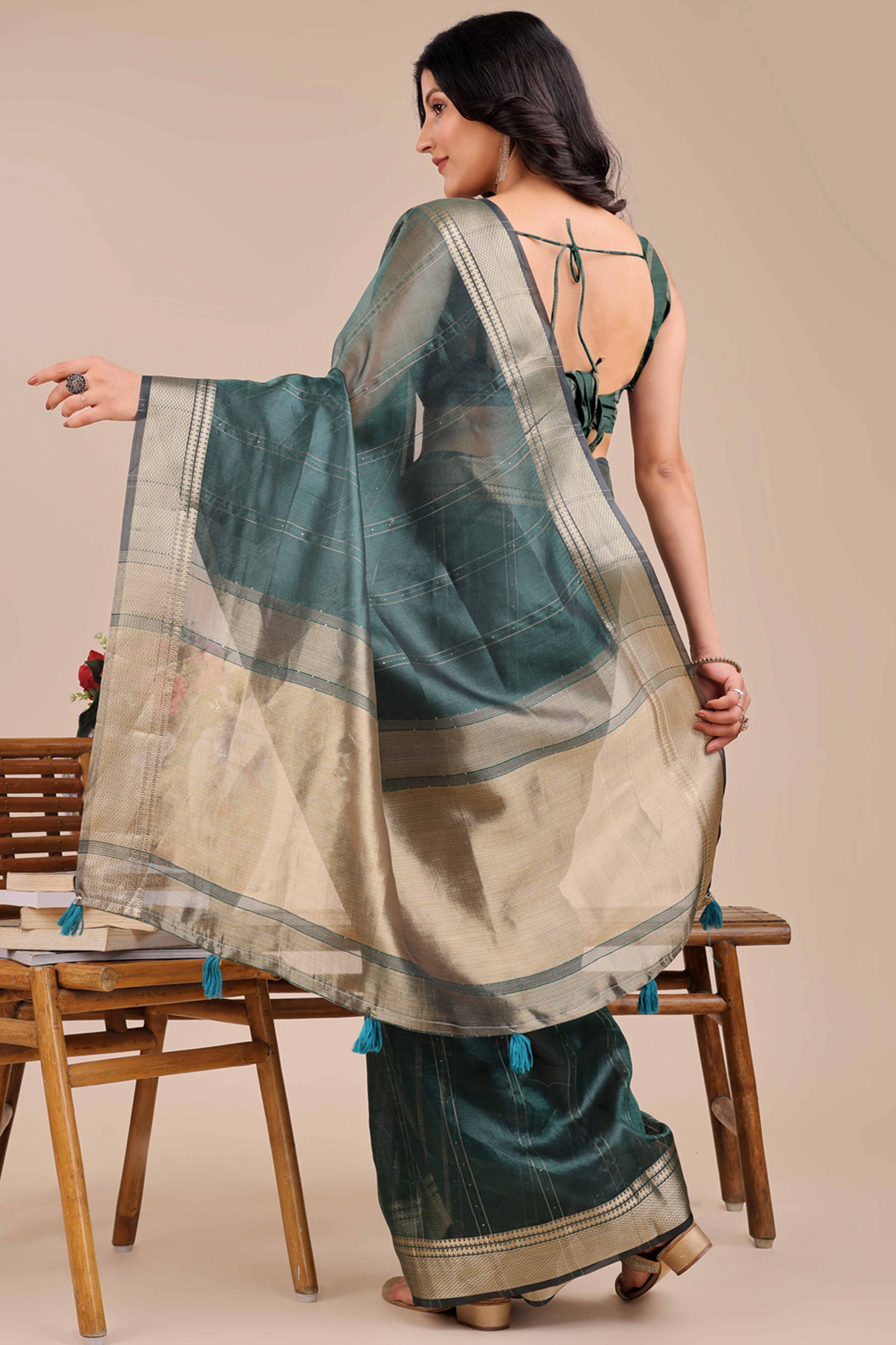 Dark Green Hue Organza Saree with Shimmering Zari Border Weave