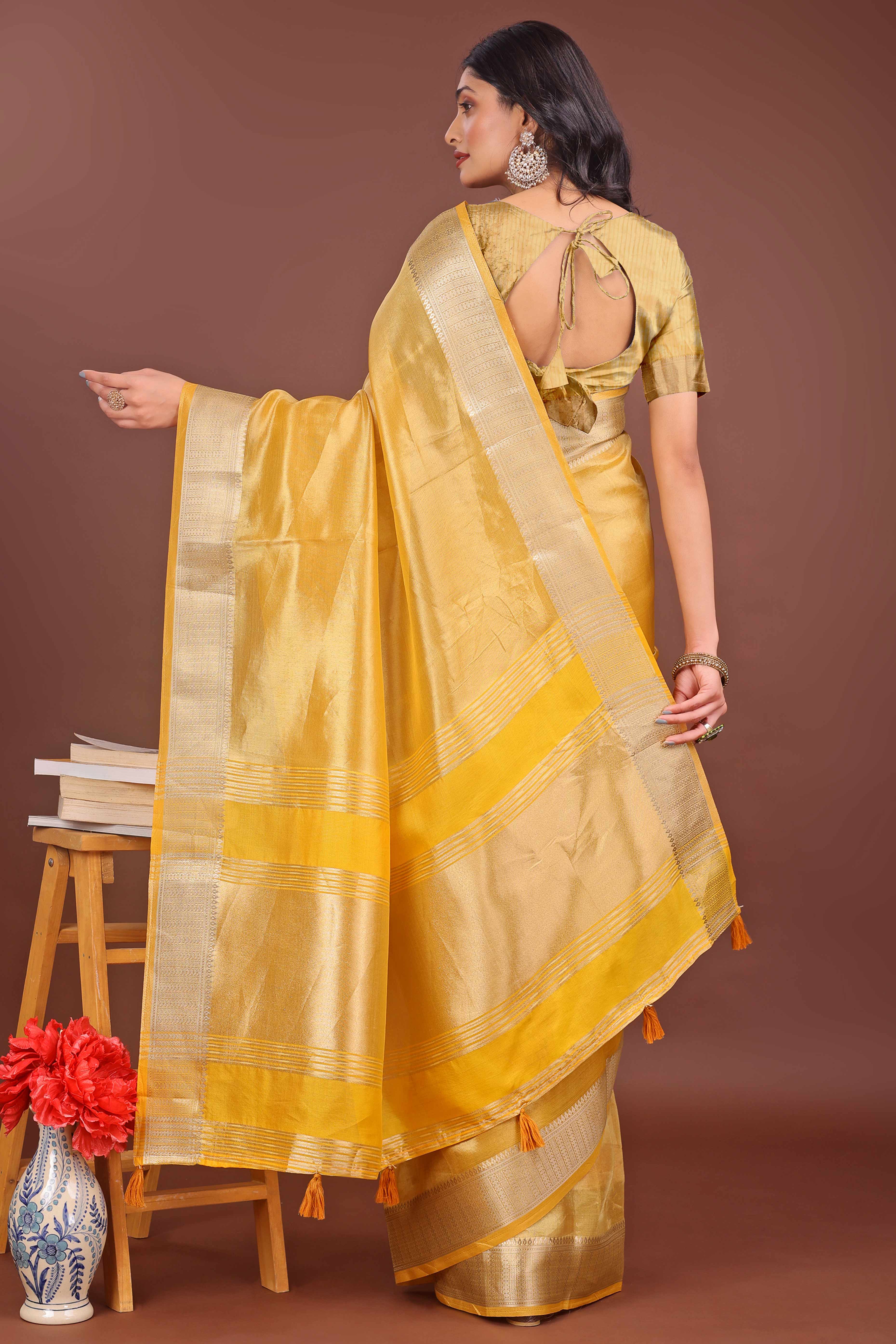 Yellow Organza Solid Saree With Lustrous Zari Weave &  Delicate Tassels