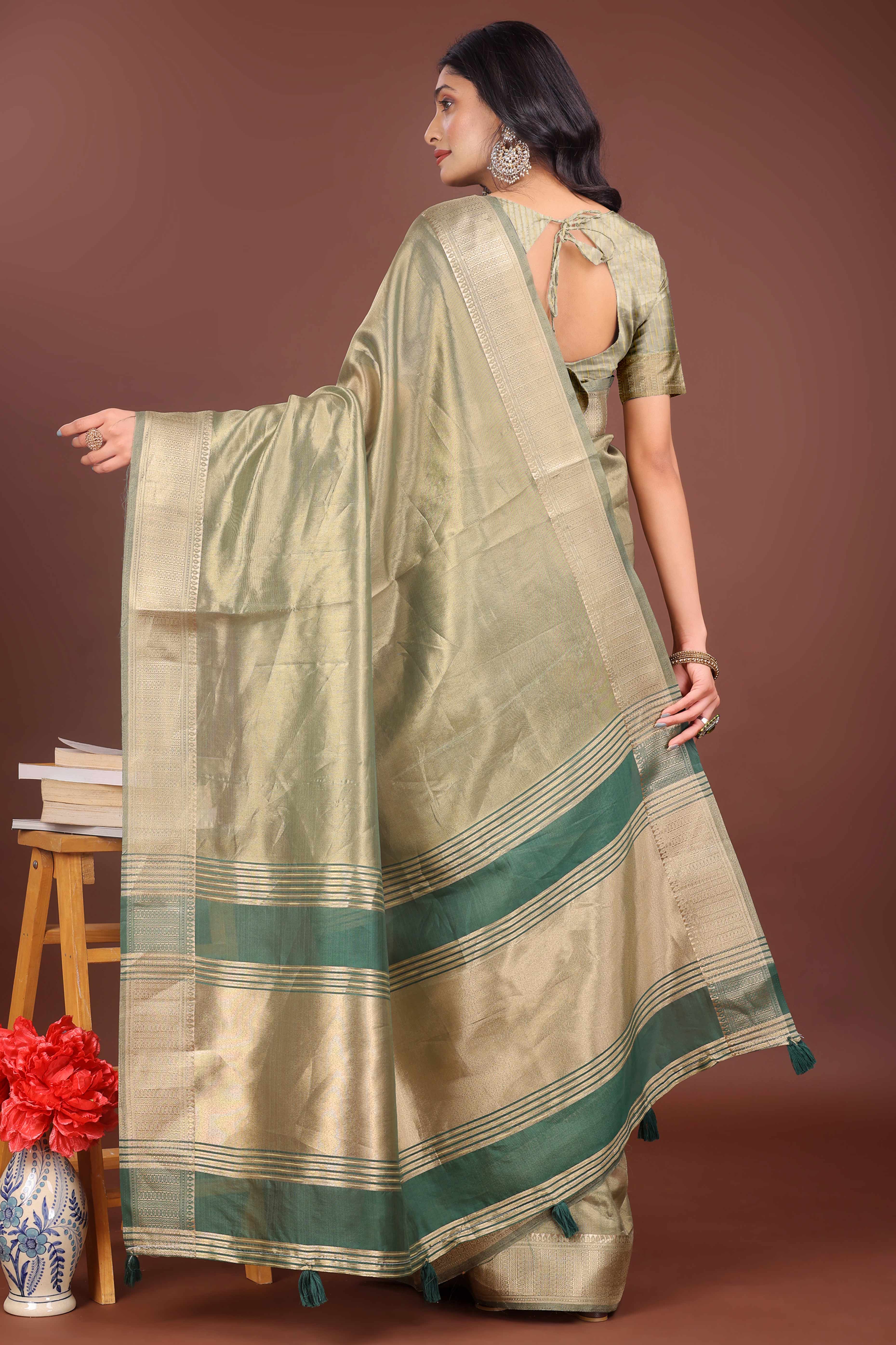 Green Organza Solid Saree With Lustrous Zari Weave &  Delicate Tassels