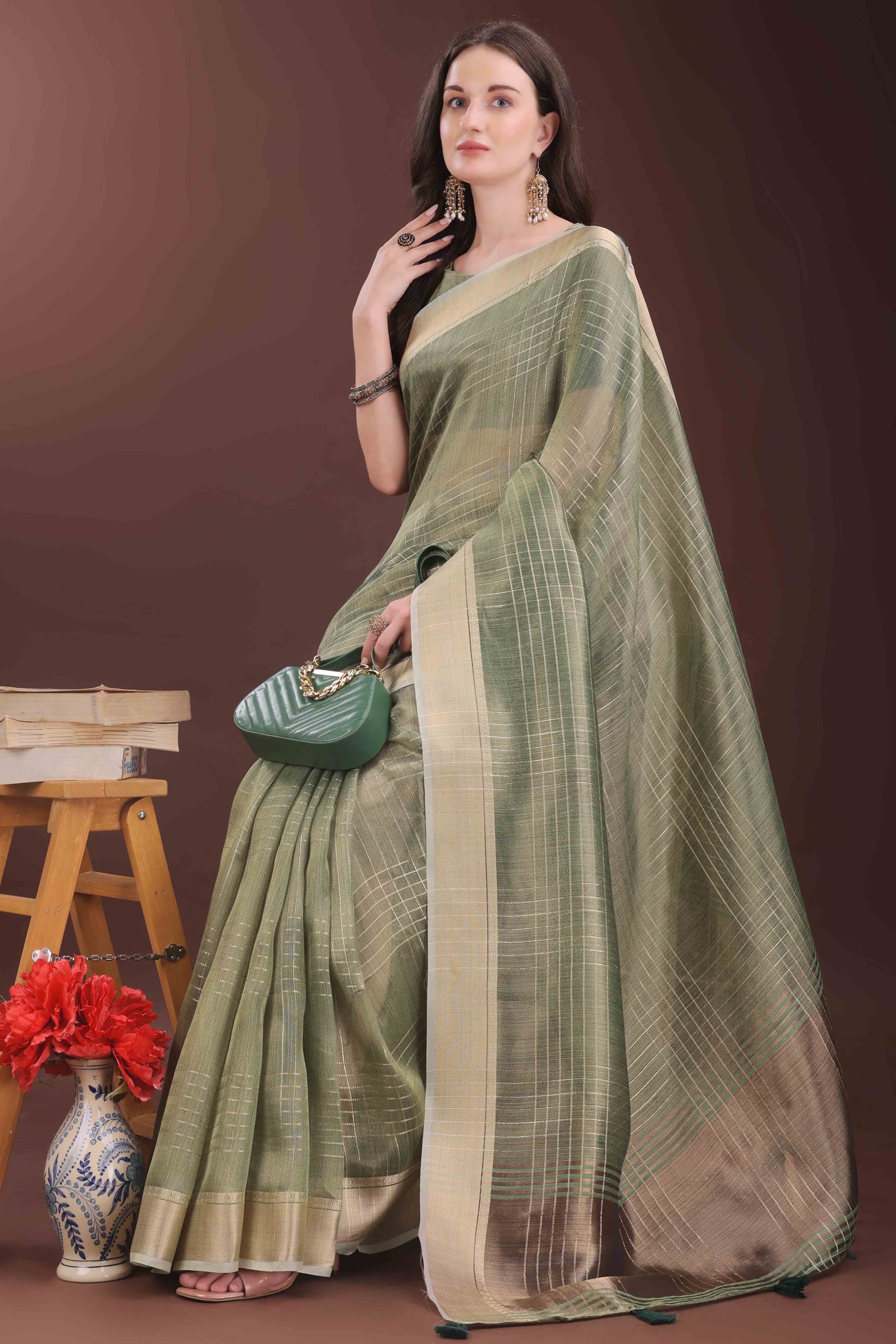 Green Organza Saree With Zari Weaving Check Patterns & Elegant Tassel Accents