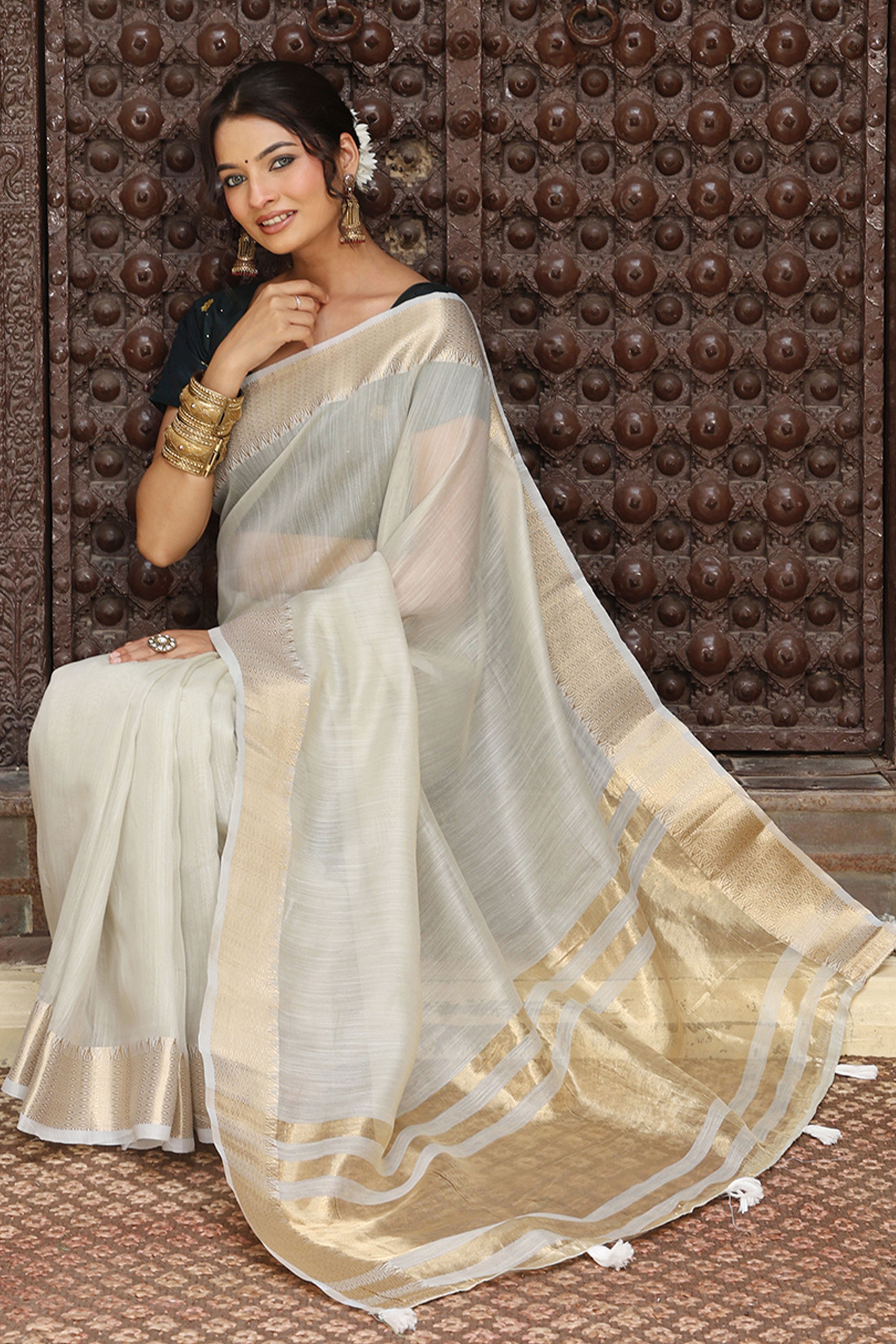 Charming Grey Zari Weaving Cotton Blend Saree Adorned With Stylish Tassel Detailing