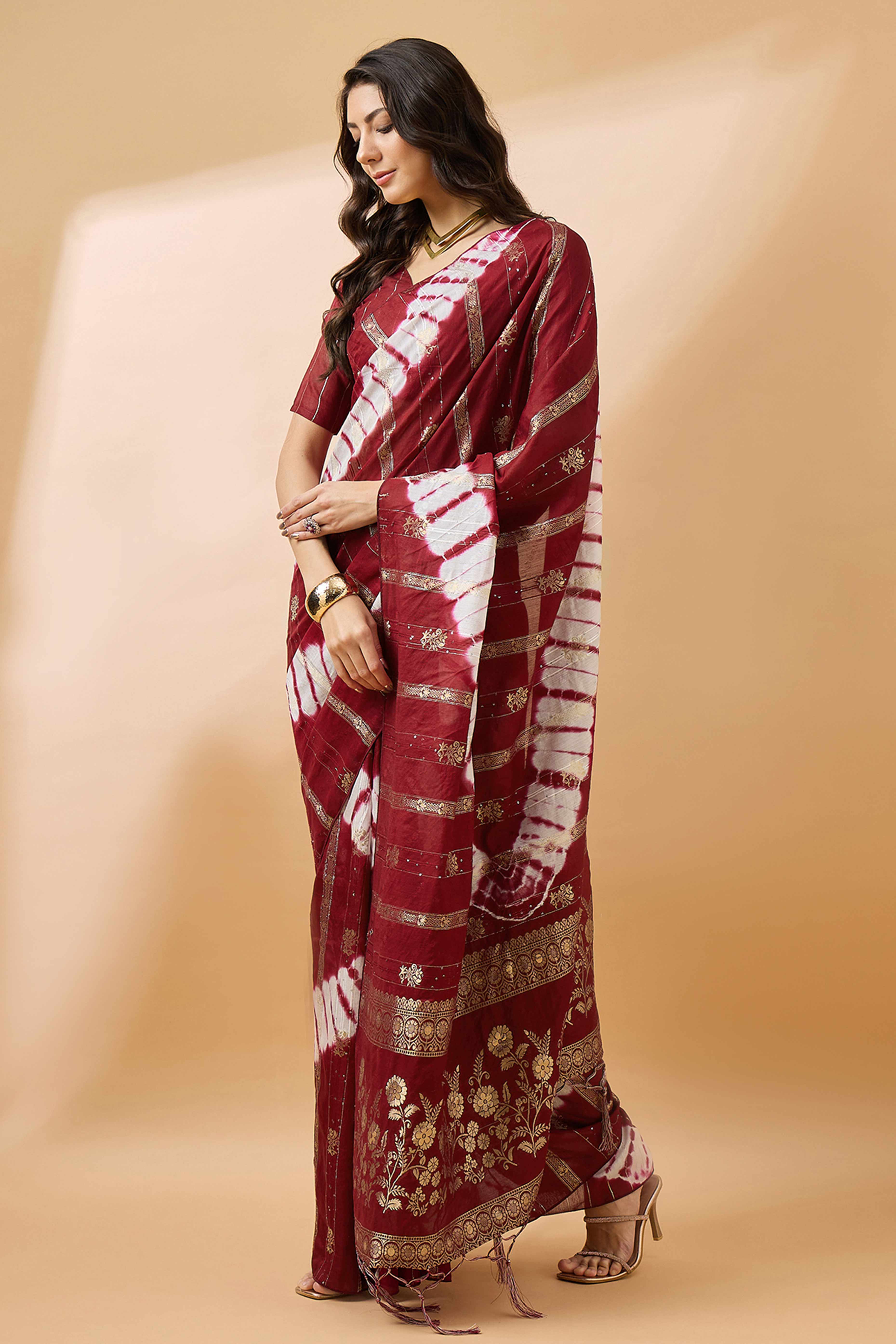Maroon Floral Woven Staple Cotton Blend Saree Highlighted With Sequins Embroidery & Tasselled Pallu